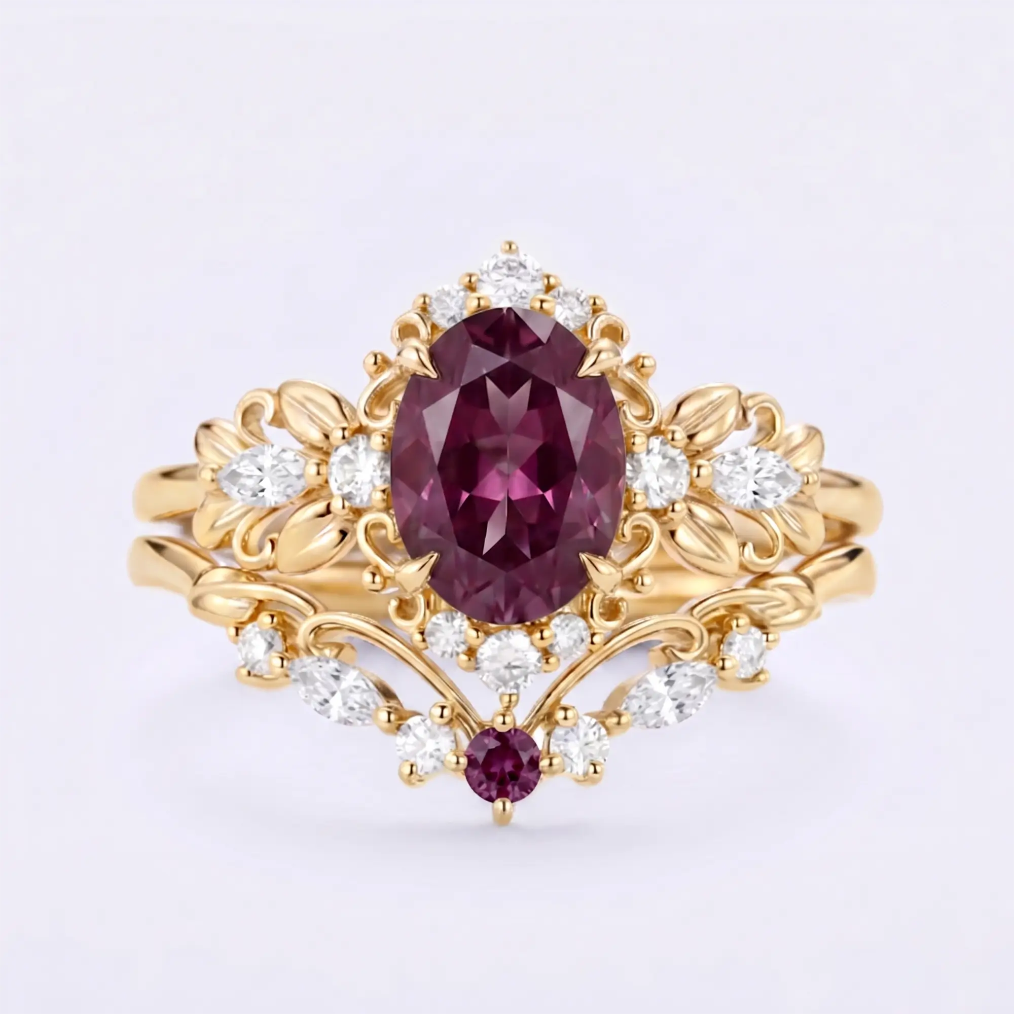 Handcrafted vintage-inspired oval lab-grown alexandrite engagement ring stacked with a sculpted leafy marquise moissanite wedding band in solid yellow gold by Orleone
