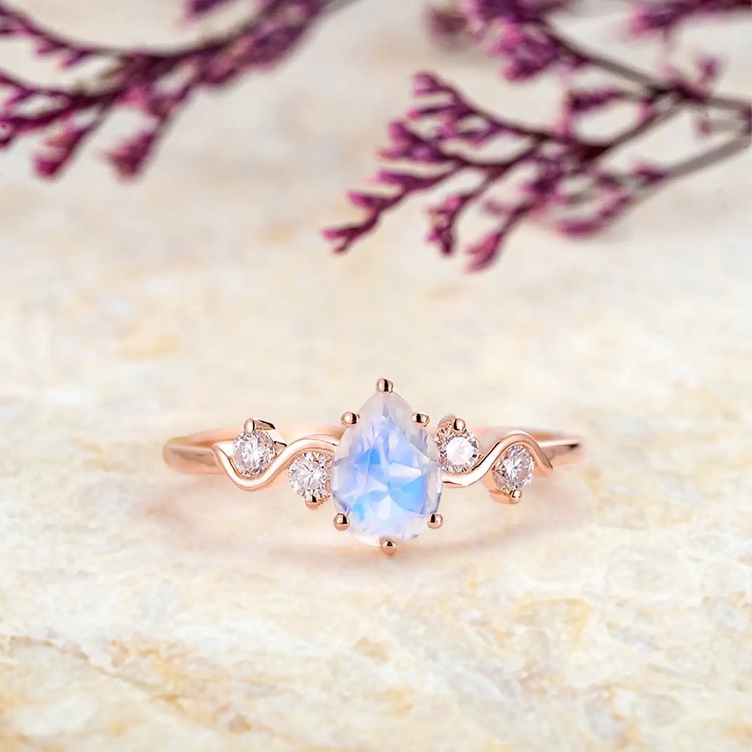 pear-moonstone-engagement-ring-five-stone-rose-gold-twist-band-orleone