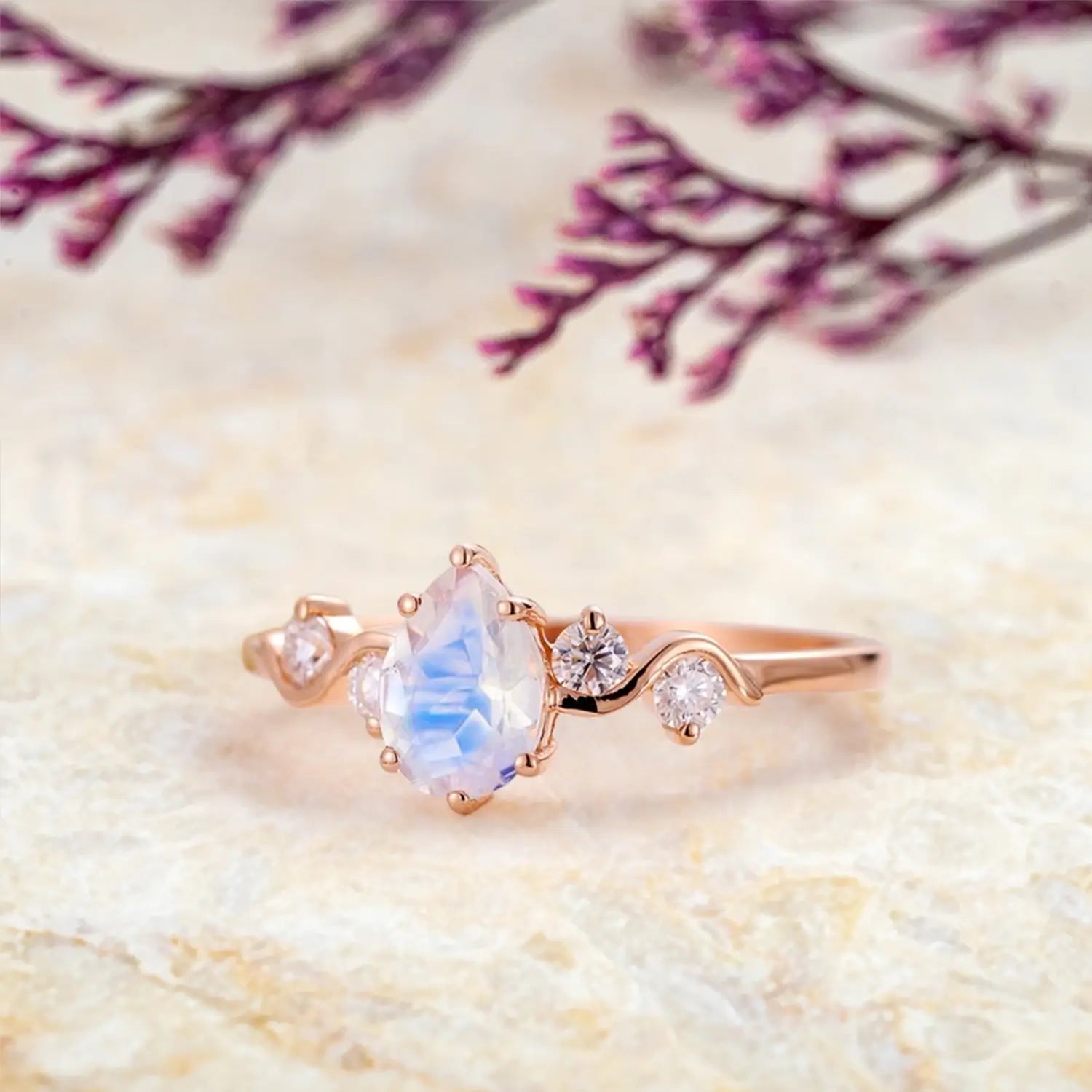 pear-moonstone-engagement-ring-five-stone-rose-gold-twist-band