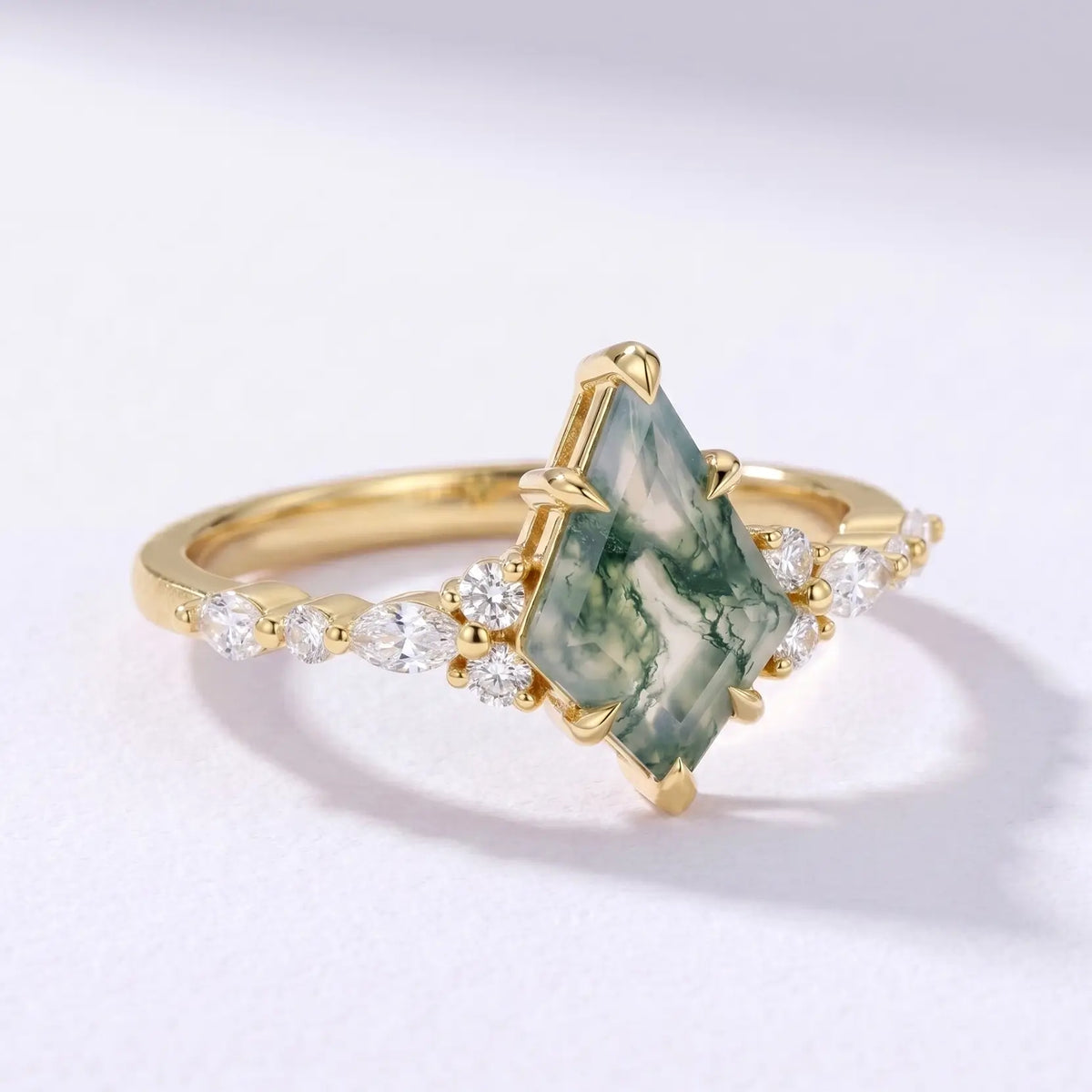 Side profile view of a dainty 1.7mm solid gold moss agate ring band showcasing a low-profile setting and polished finish