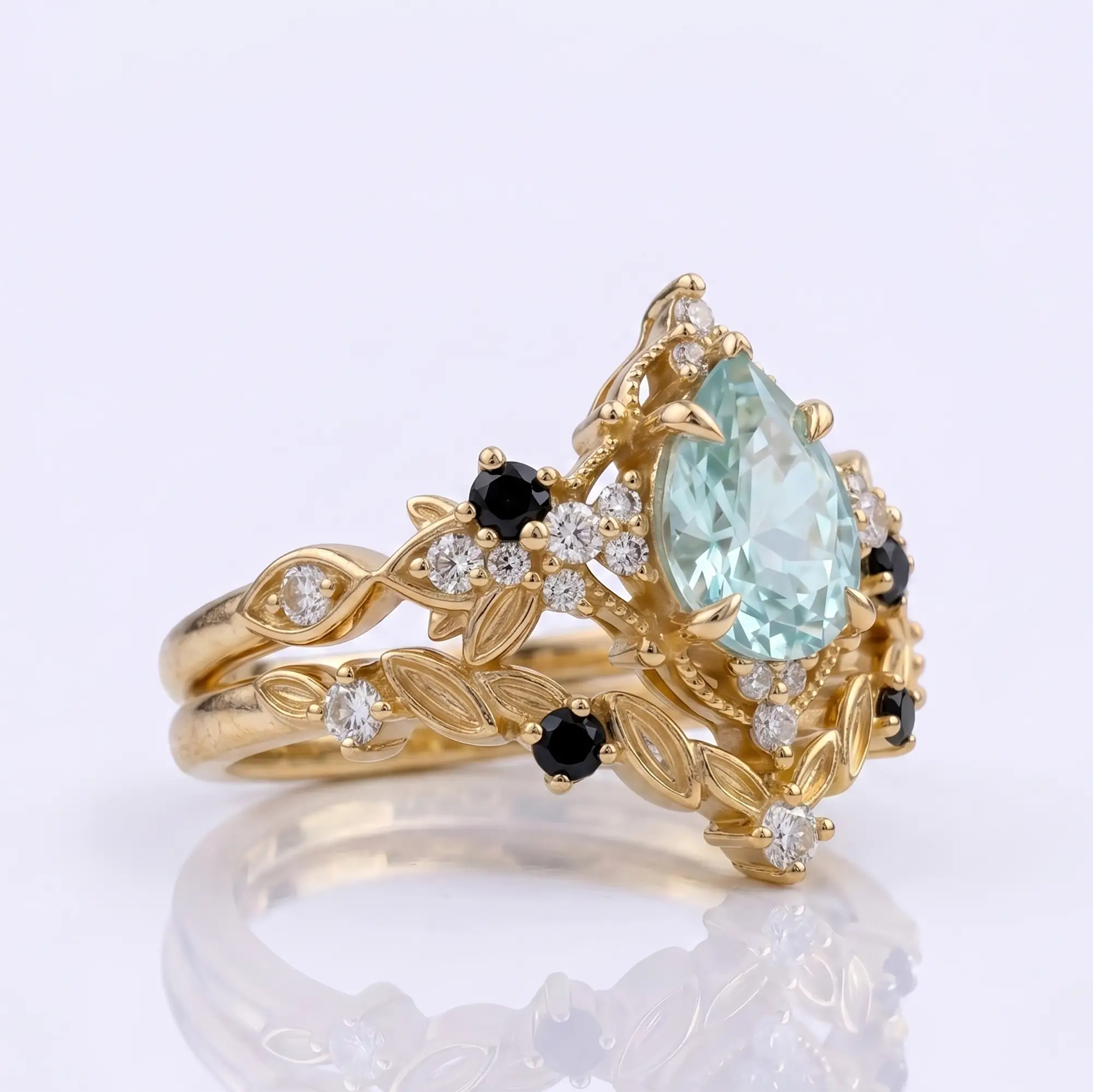 Side macro view of a thin gold grey moissanite stacked set showing the low-profile prong settings and fluid leaf-carved textures