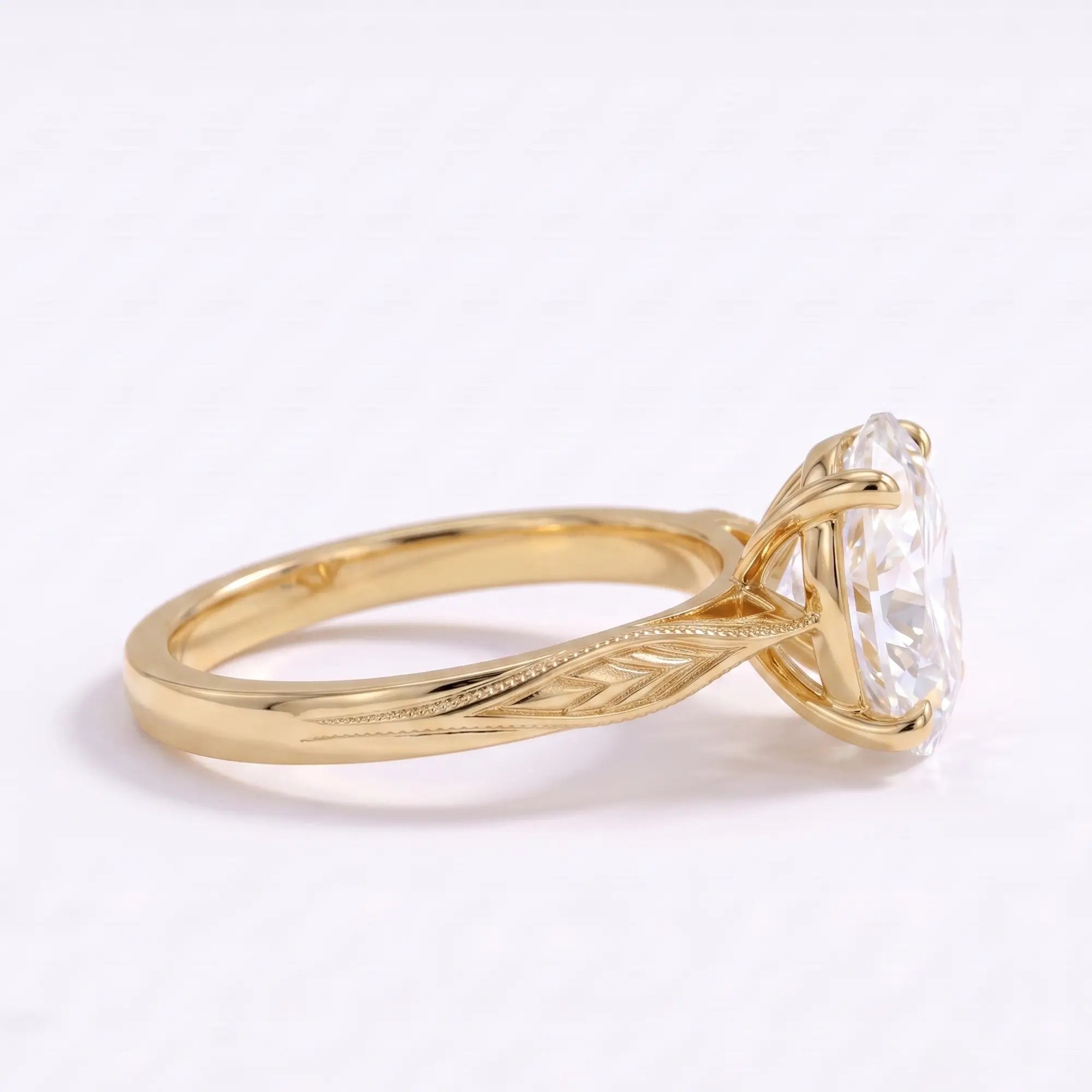 Right angle of oval lab diamond engagement ring with engraved botanical gold band