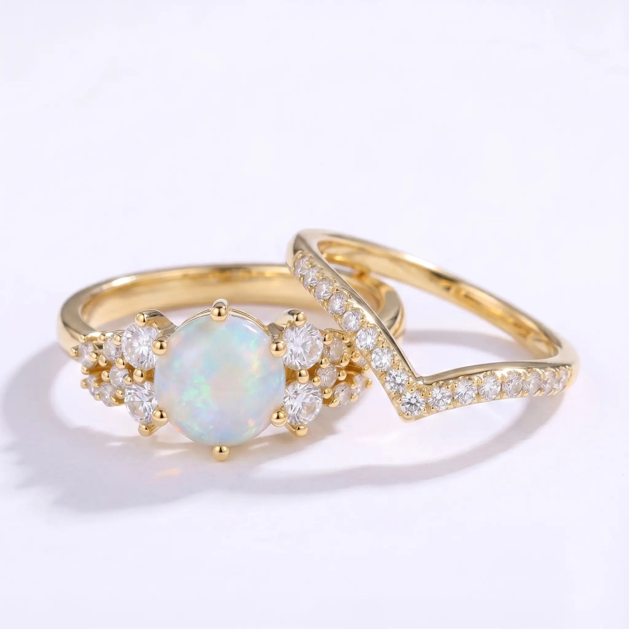 Round opal cluster ring set worn on hand with a matching V-shaped band