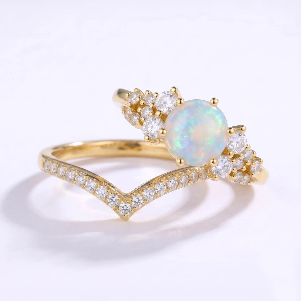 round opal promise ring set styled in a soft romantic jewelry scene