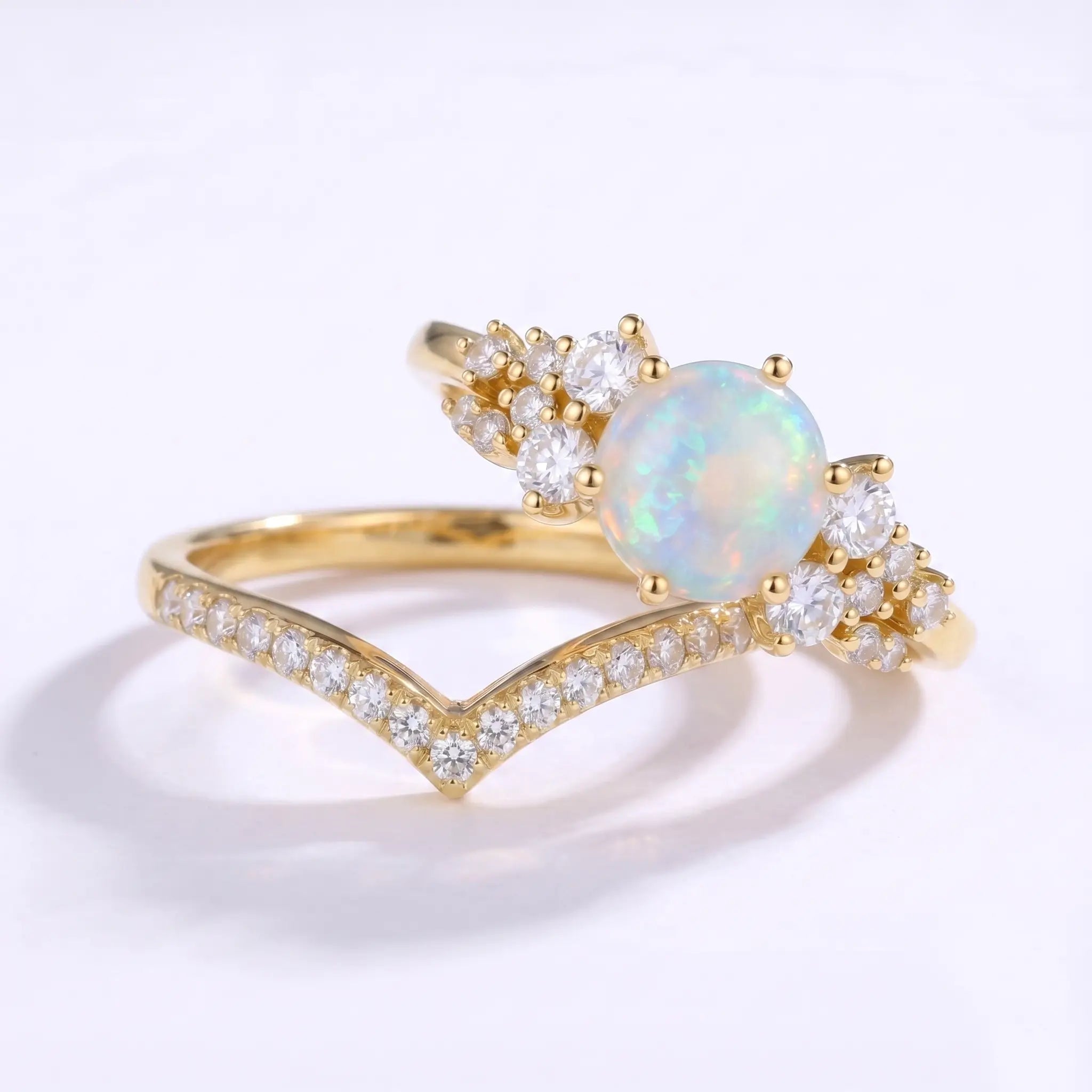 round opal promise ring set styled in a soft romantic jewelry scene