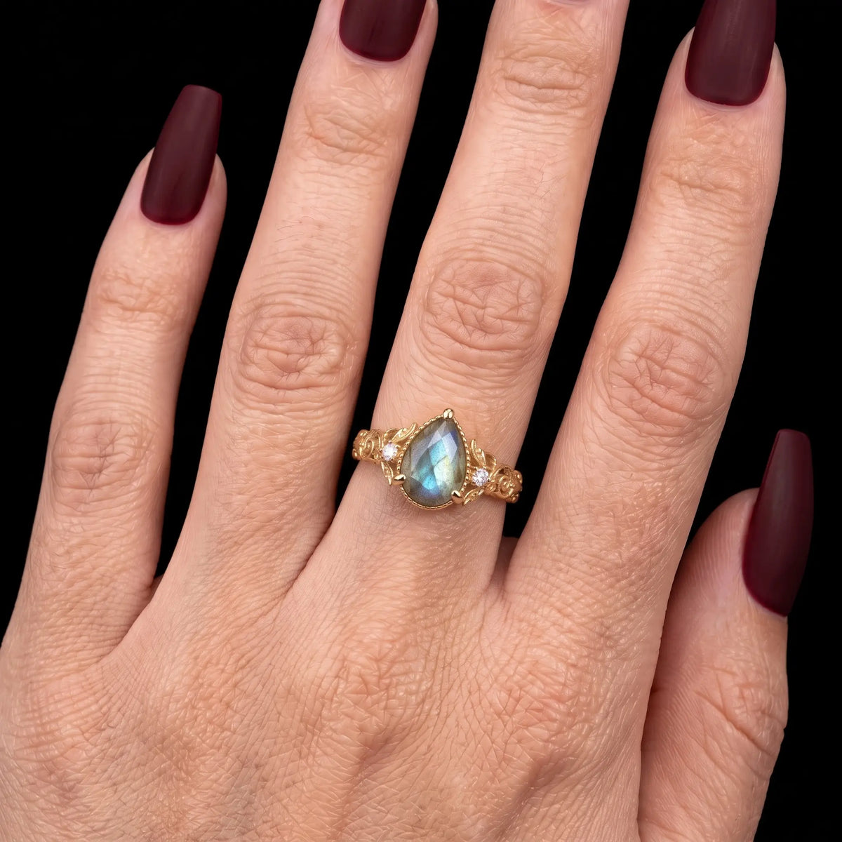 Close view of pear cut natural labradorite engagement ring for women
