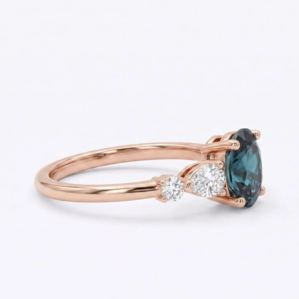 Side view of a thin gold alexandrite ring band showing low-profile prong work and secure gemstone placement  view