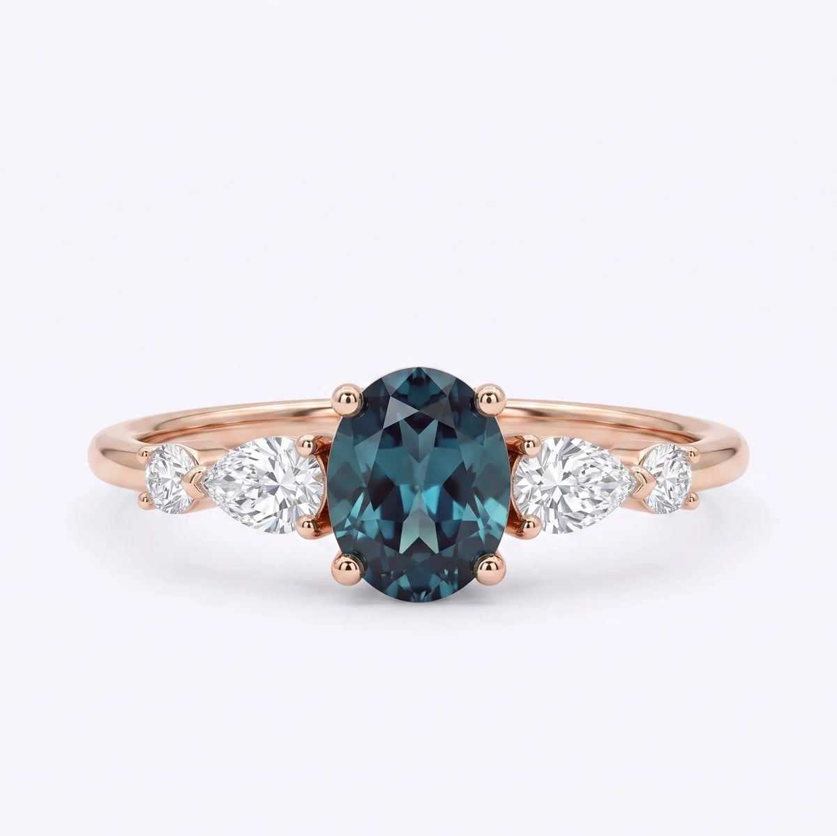 Handcrafted dainty 5-stone oval lab alexandrite engagement ring with pear and round cut moissanite accents by Orleone