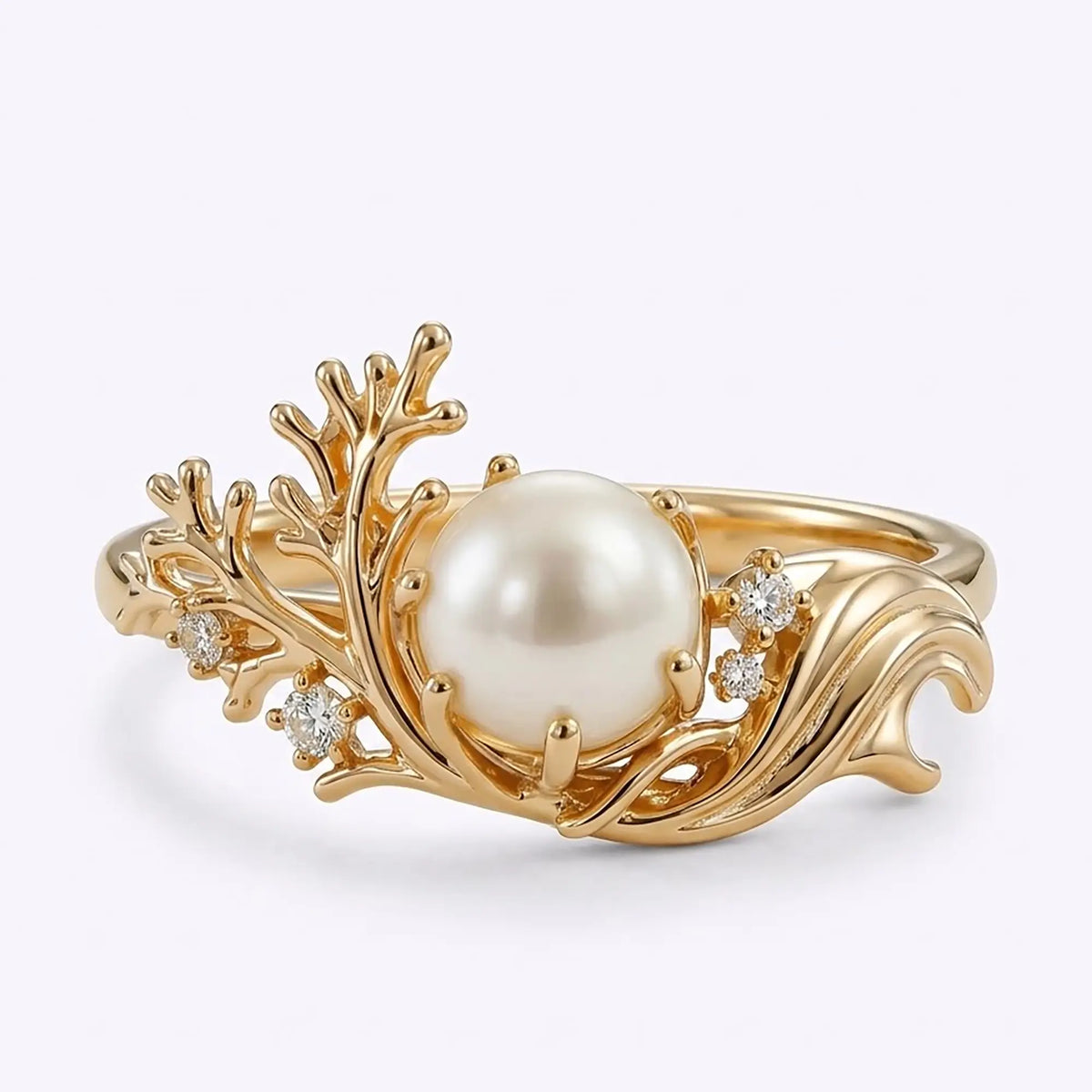 Akoya pearl ocean inspired engagement ring with asymmetrical coral gold design and moissanite accents