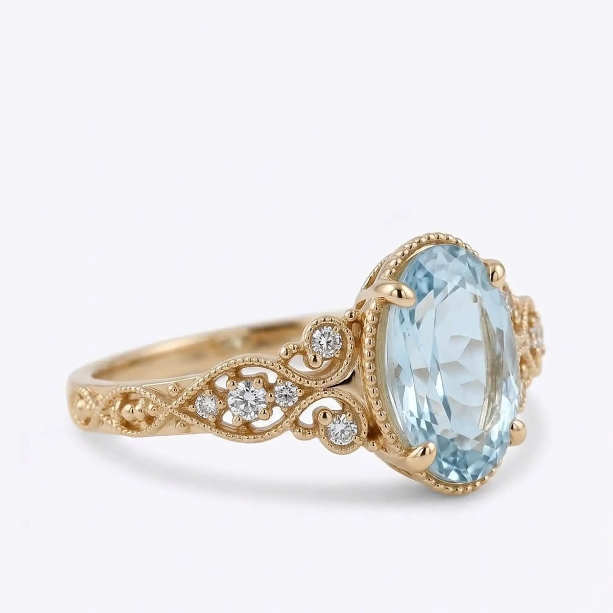 Antique inspired oval aquamarine gold ring with milgrain detail