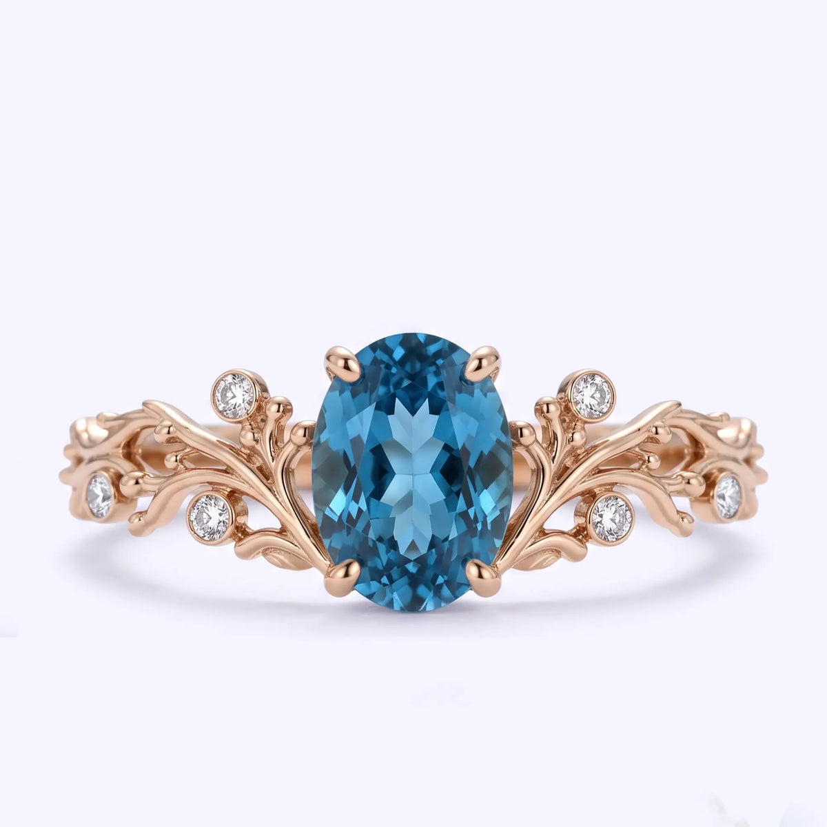 Oval London blue topaz ocean inspired engagement ring in rose gold