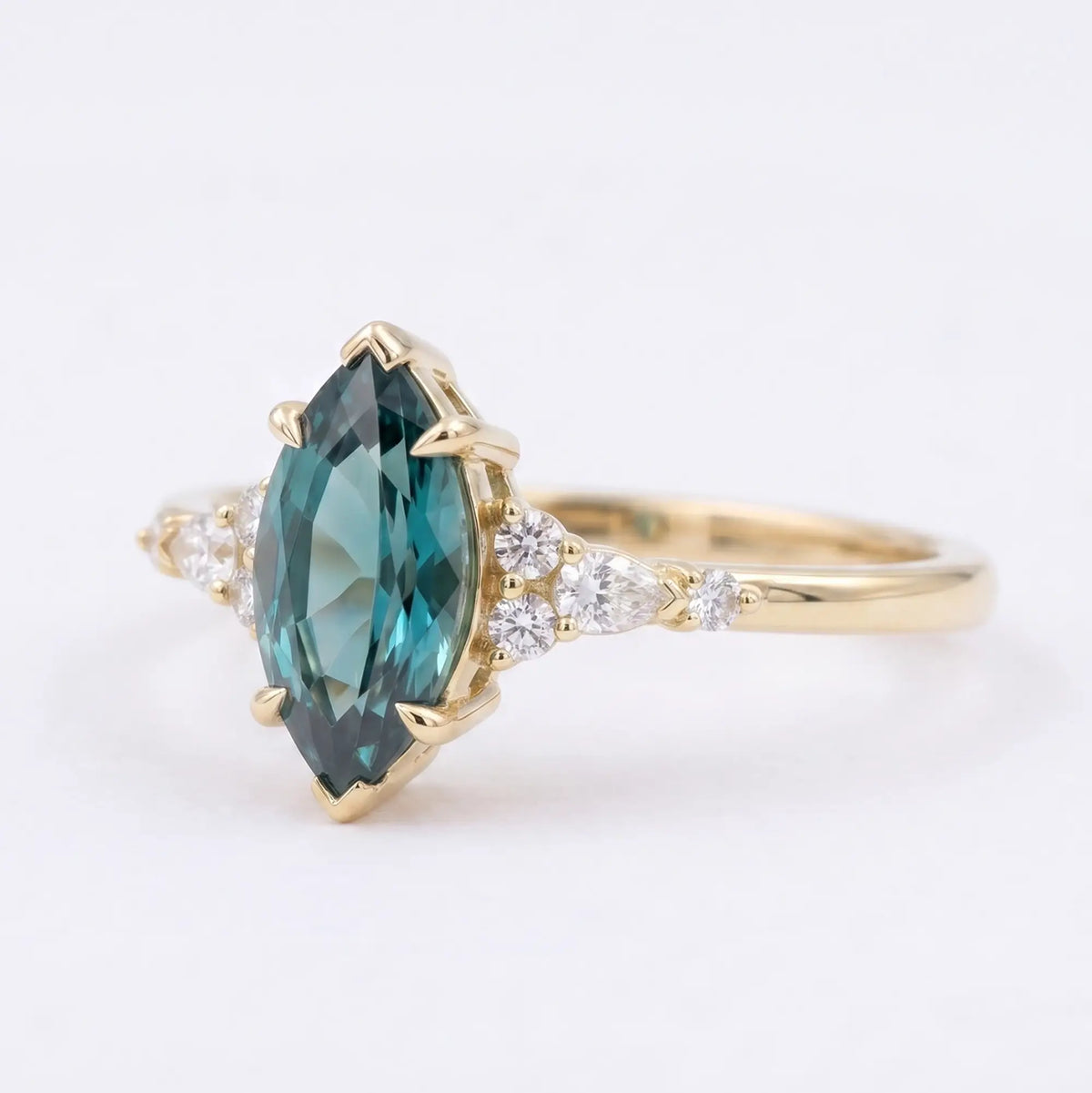 Side view of a thin solid rose gold alexandrite ring band showing low-profile cluster work and secure prongs
