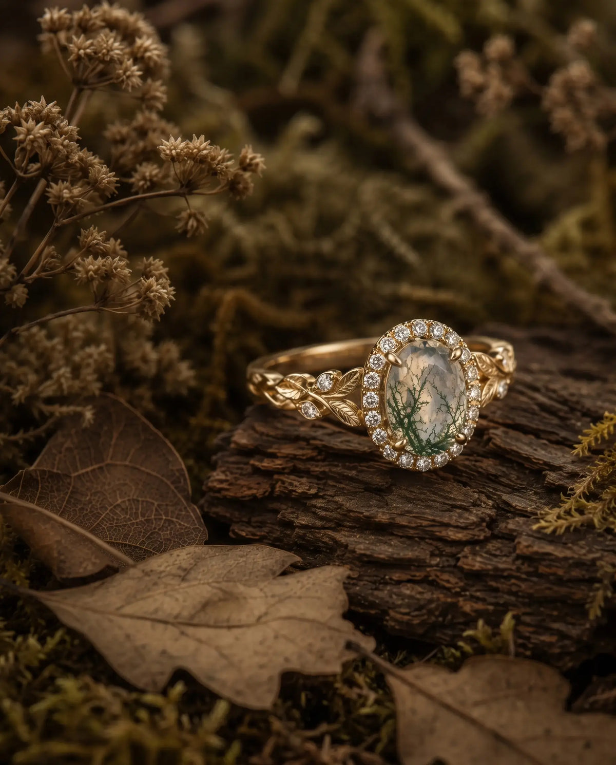 Nature inspired oval moss agate halo ring styled in an elegant jewelry scene