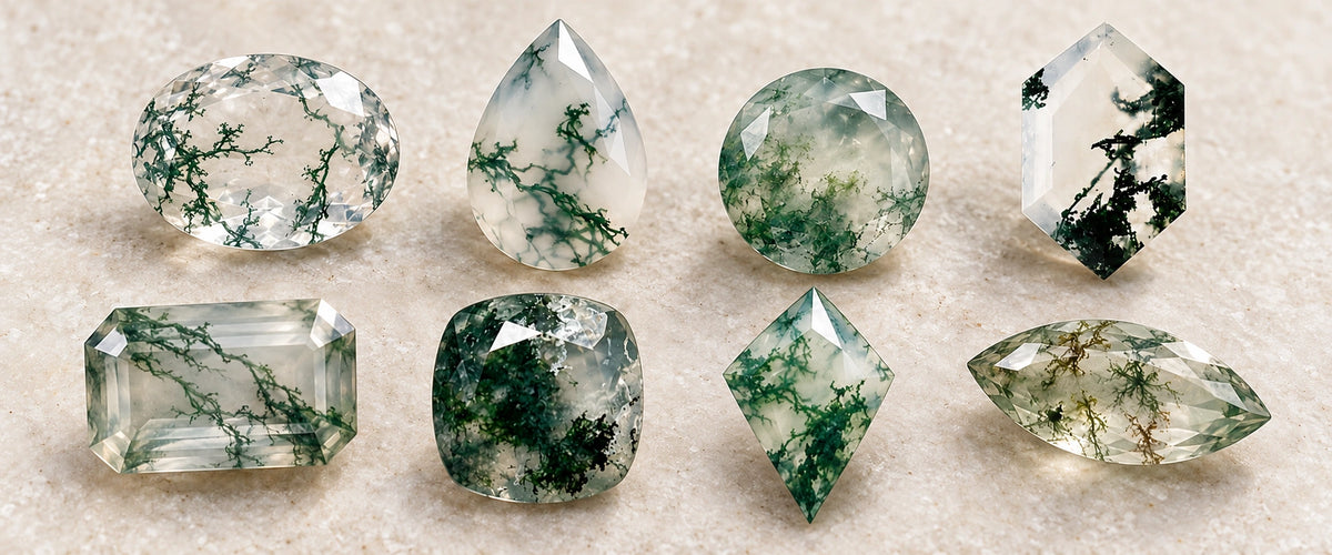 Illustrative macro arrangement of eight loose moss agate gemstones, showing clear, milky-white, pale-green and dense-green bodies with branching and clustered inclusions in varied cuts.