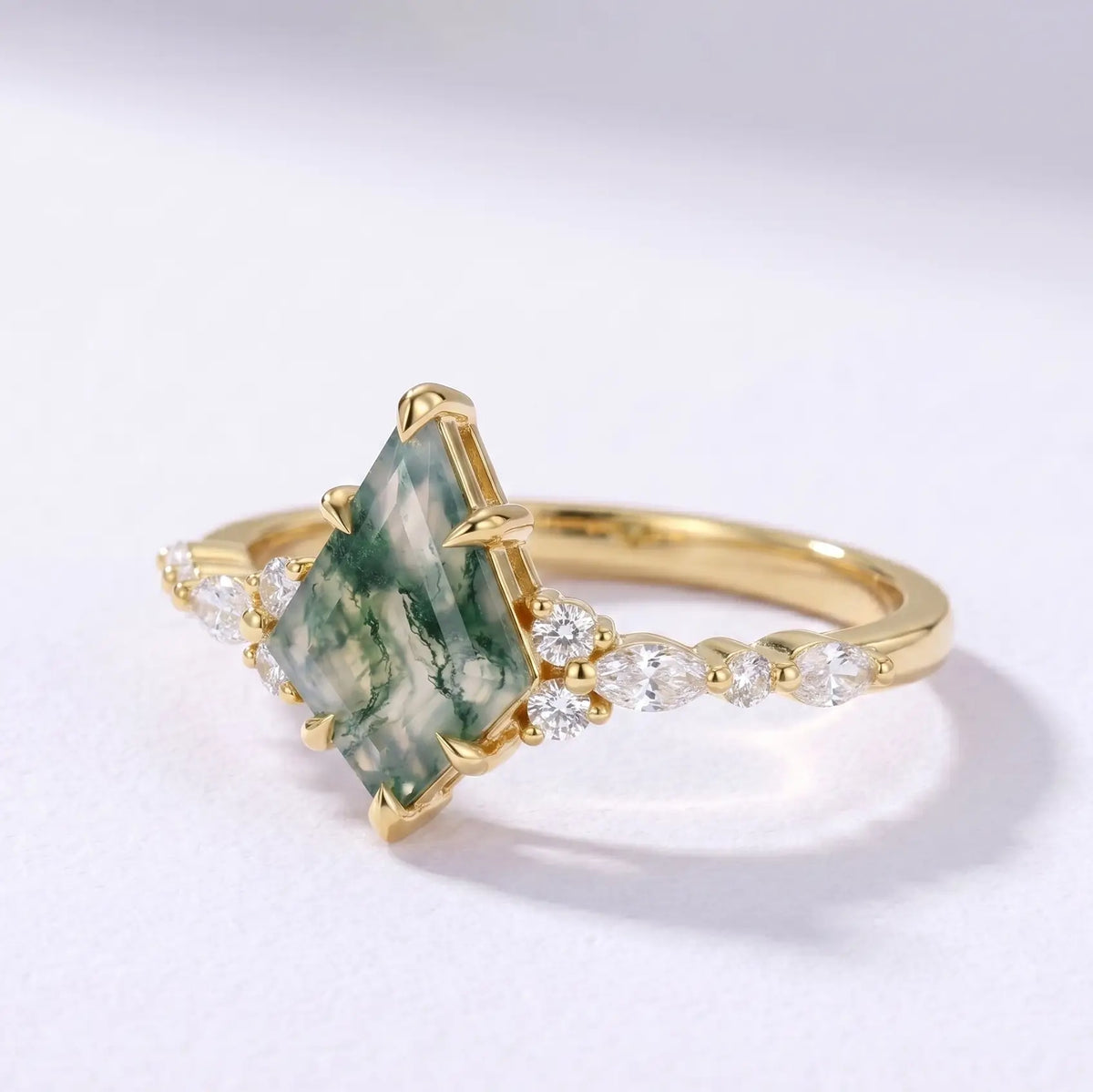 Side profile view of a dainty 1.7mm solid gold moss agate ring band showcasing a low-profile setting and polished finish