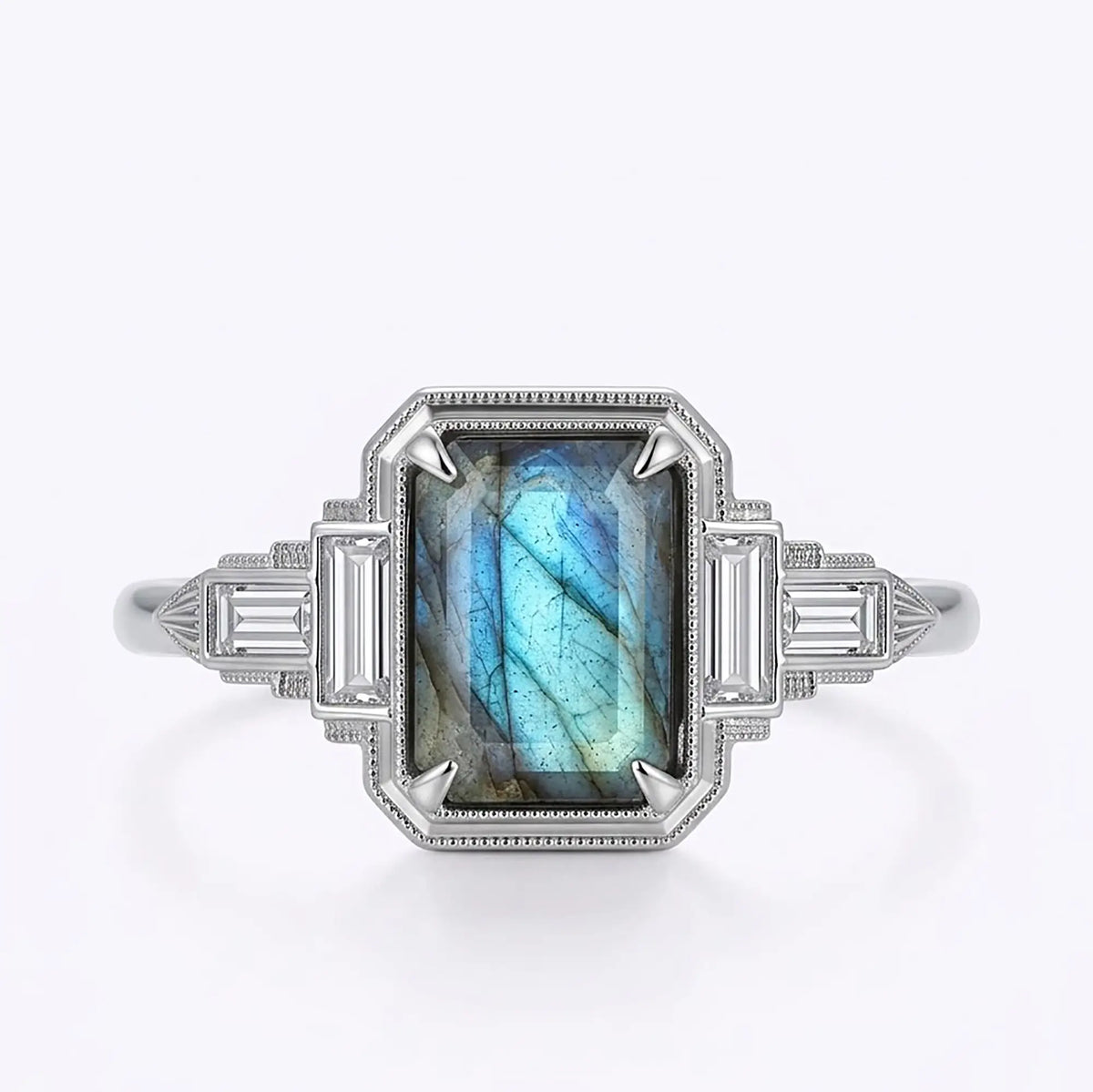 Vintage Art Deco natural emerald cut labradorite engagement ring with blue flash and baguette moissanite accents in white gold