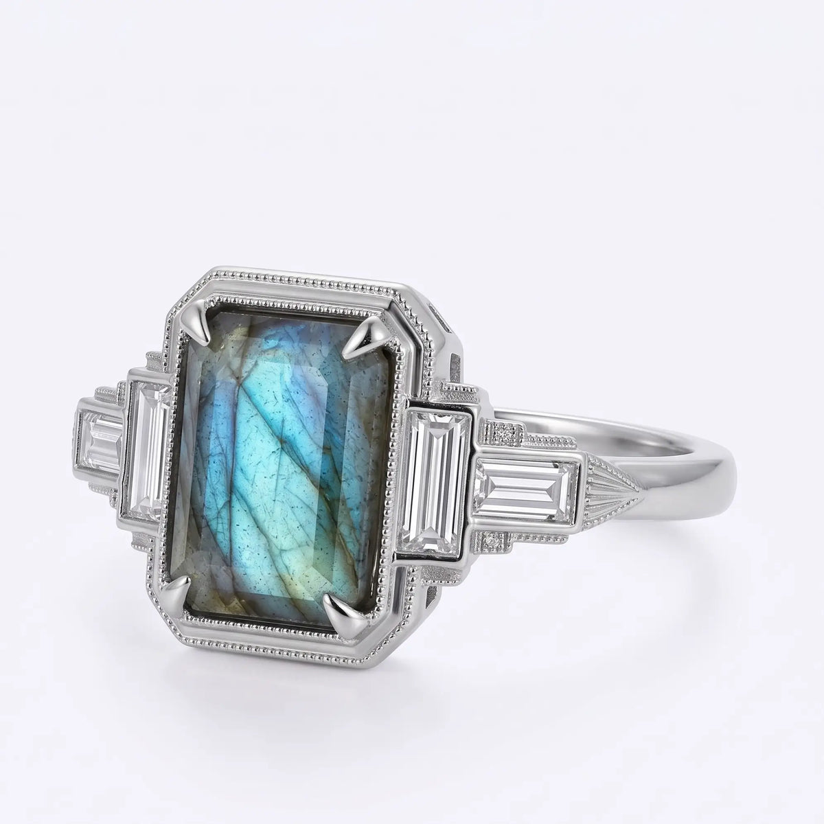 Front view of geometric Art Deco emerald cut labradorite ring with four symmetrical rectangular moissanite side stones