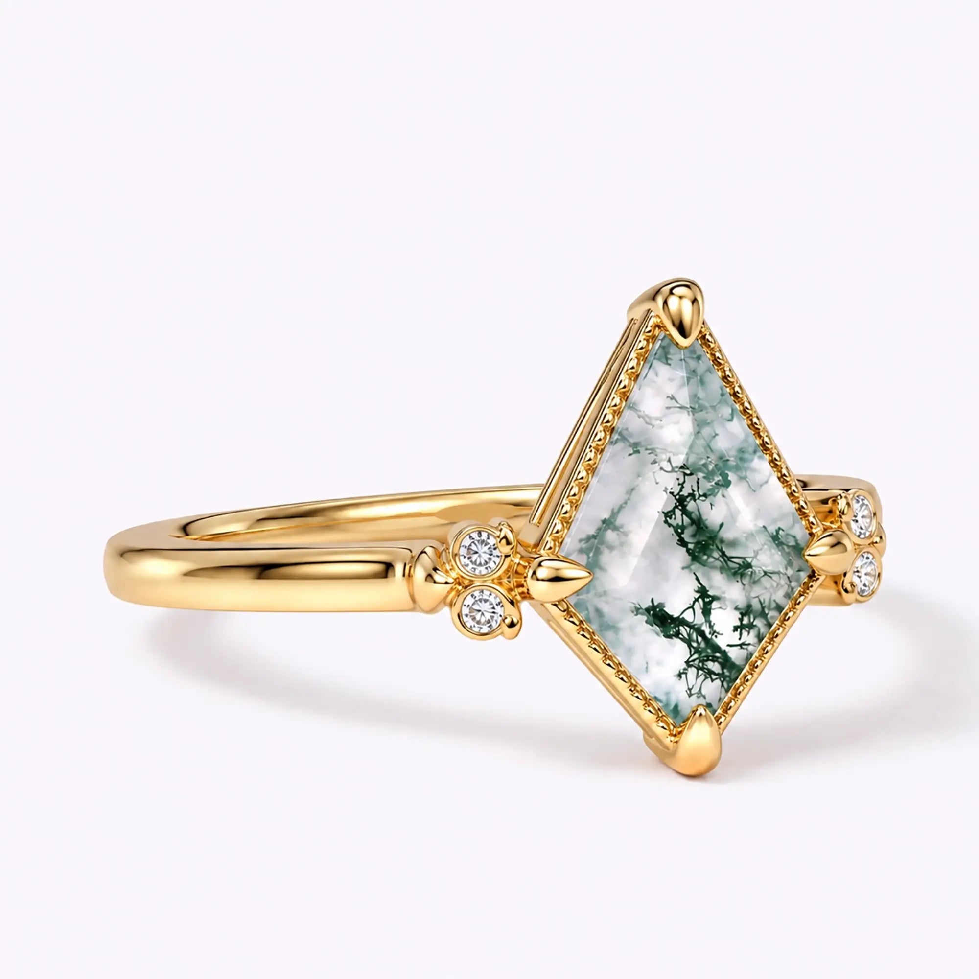 Side view of vintage moss agate owl ring showing slim gold band and setting