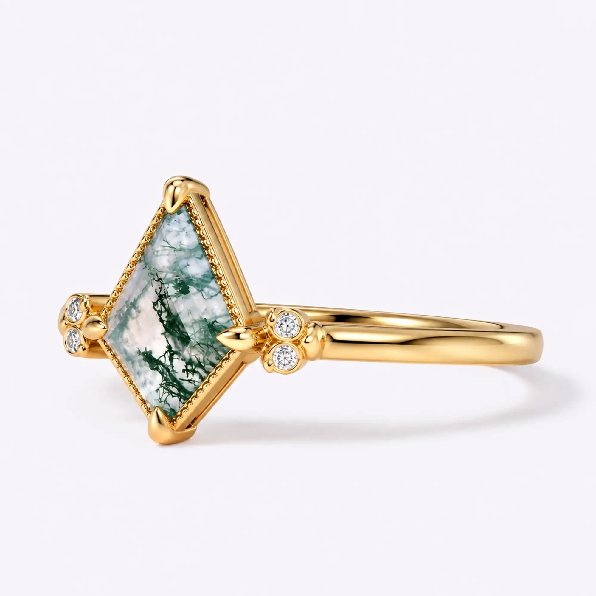 Left view of kite moss agate ring with symmetrical moissanite side accents