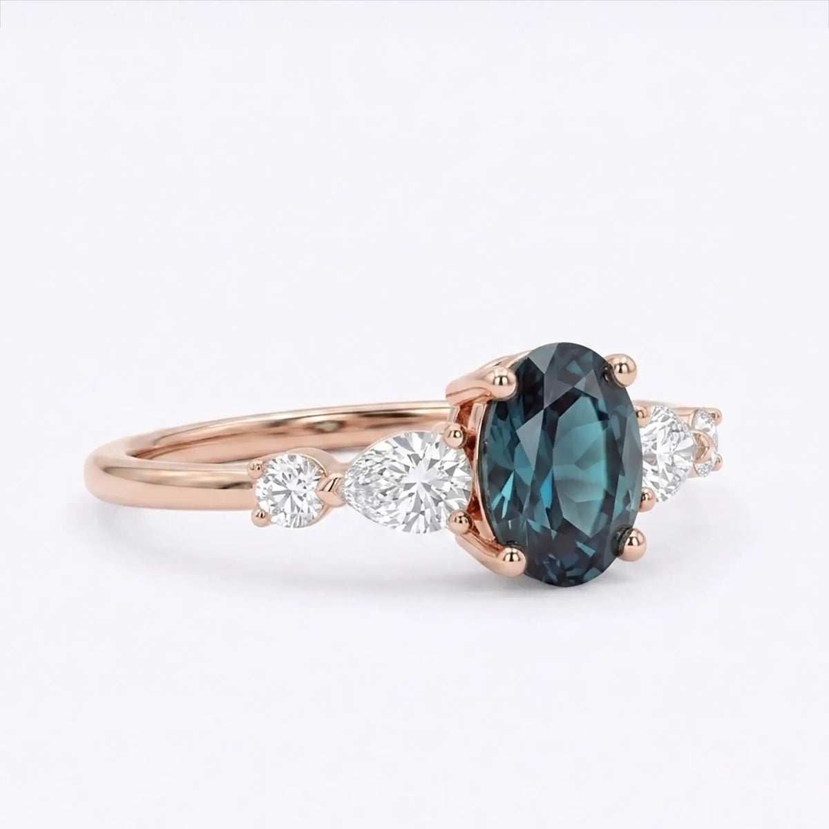 Side view of a thin gold alexandrite ring band showing low-profile prong work and secure gemstone placement 2