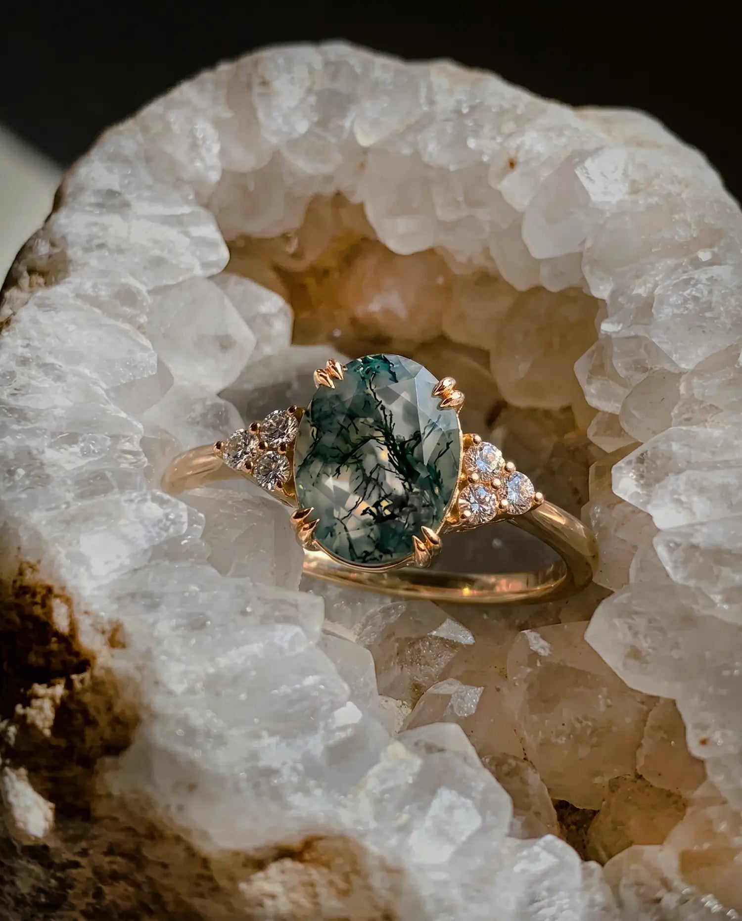 Macro close-up of a 6x8mm oval cut natural moss agate with high-shine finish