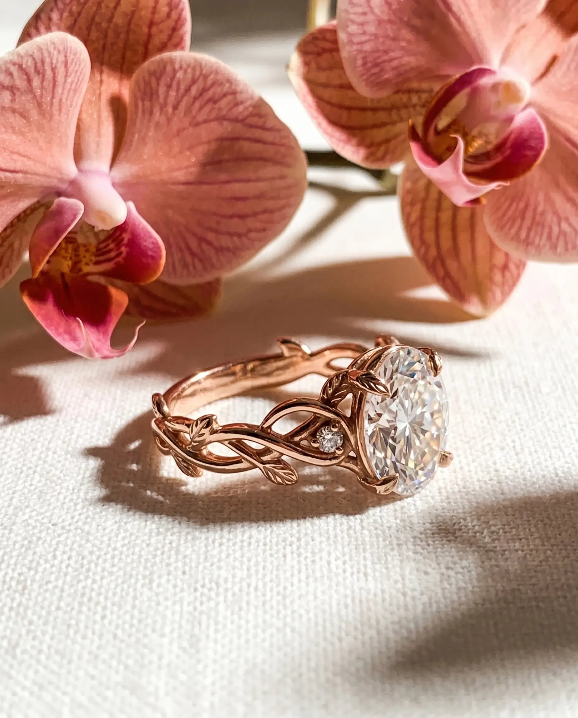 Luxury macro close-up of oval moissanite entwined vine bridal ring placed in an ethereal high-end setting
