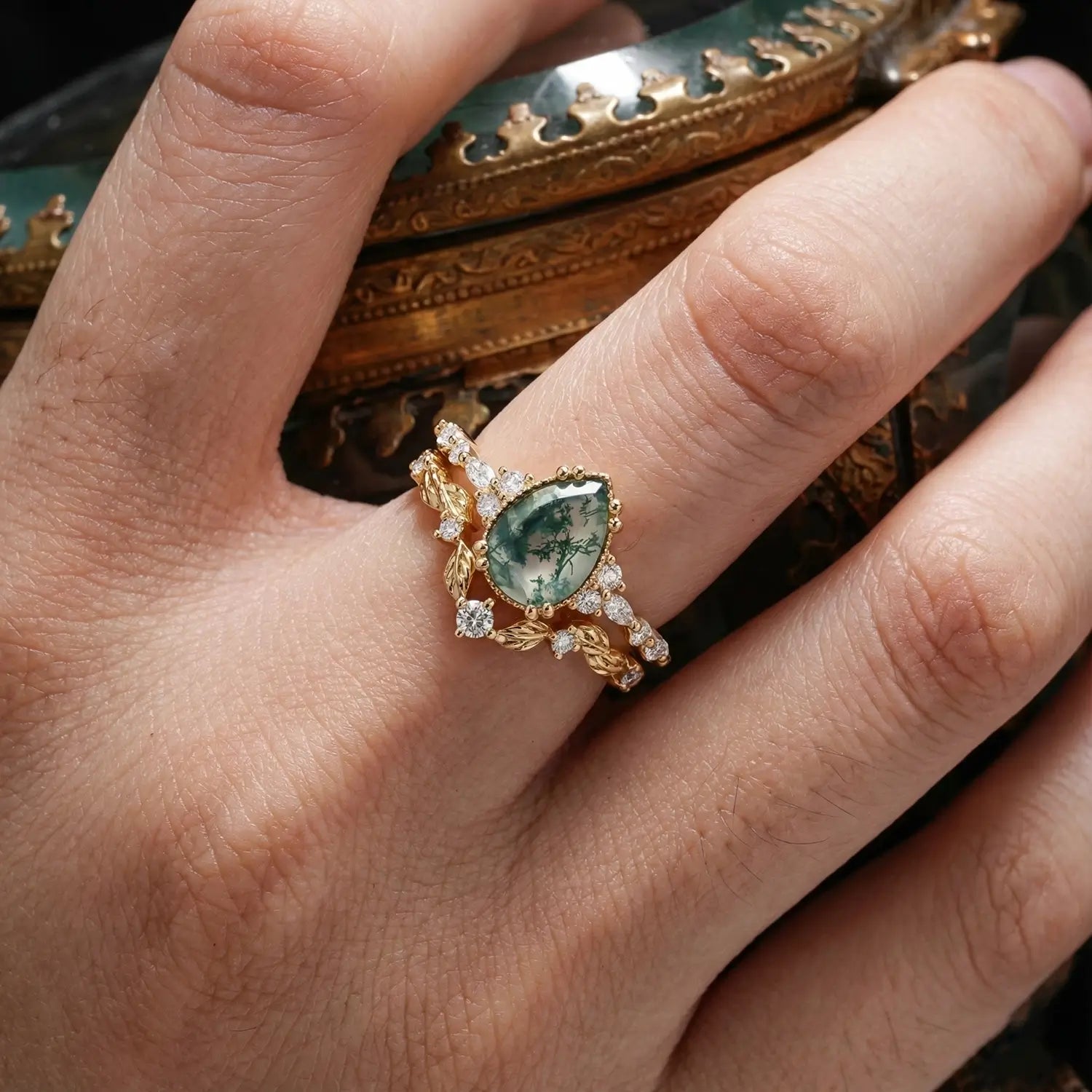 Nature inspired moss agate bridal ring set with pear cut stone and leafy vine design for women