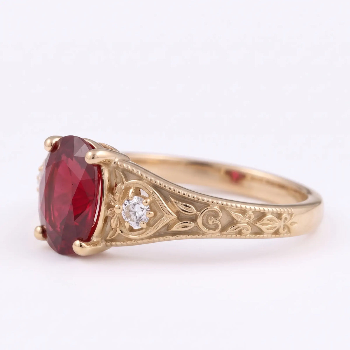 Victorian oval ruby ring with two round moissanite side stones