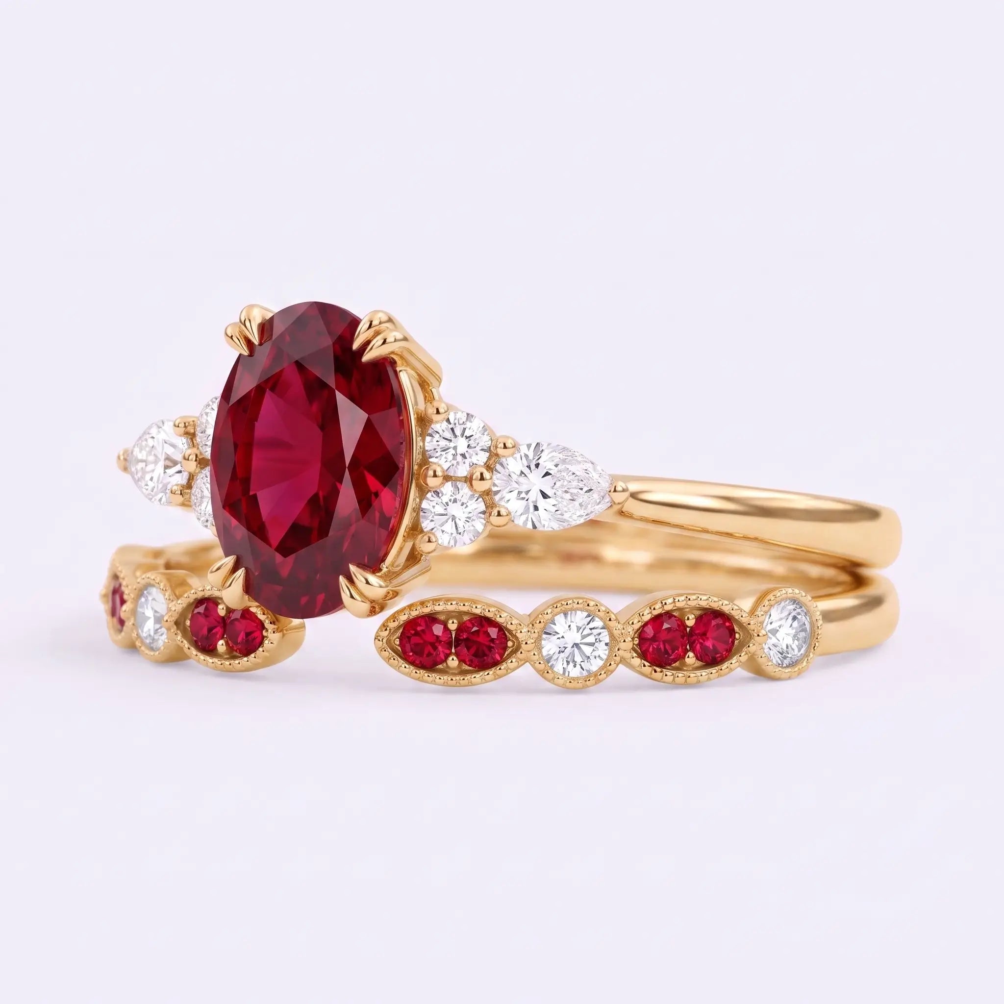 Close-up of oval lab ruby center stone with moissanite cluster accents and milgrain band