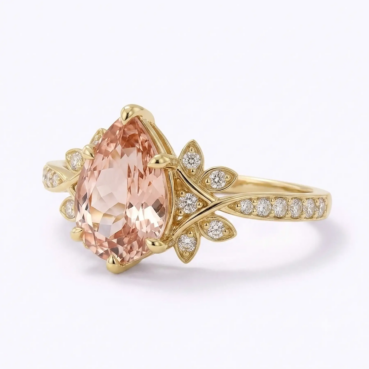 Left view of pear cut morganite cluster anniversary ring with floral side details