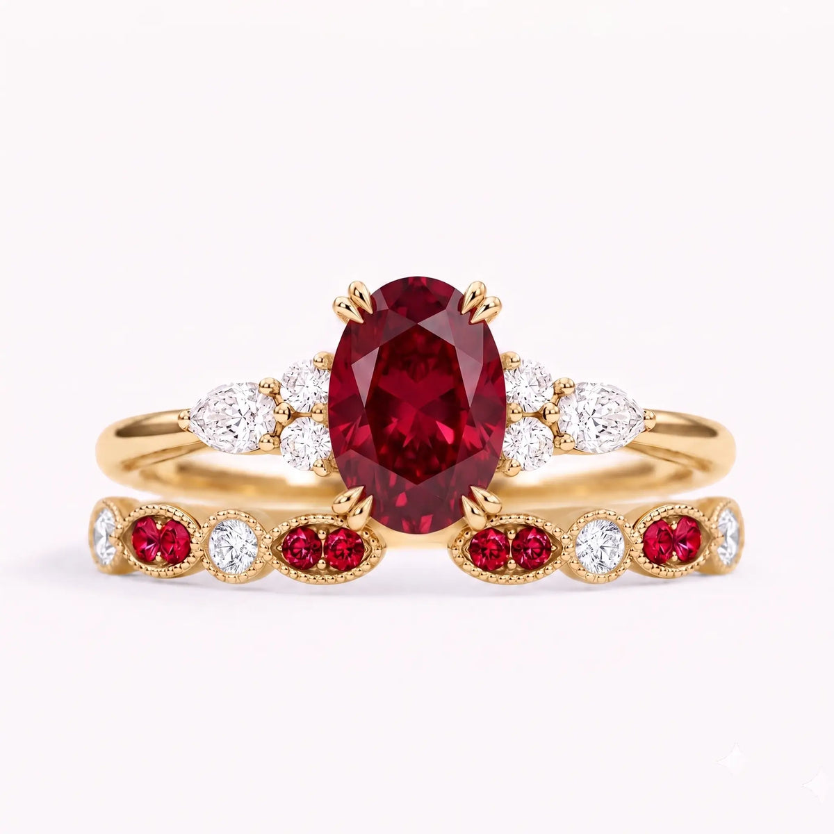 Oval cut ruby cluster bridal ring set with milgrain wedding band in yellow gold