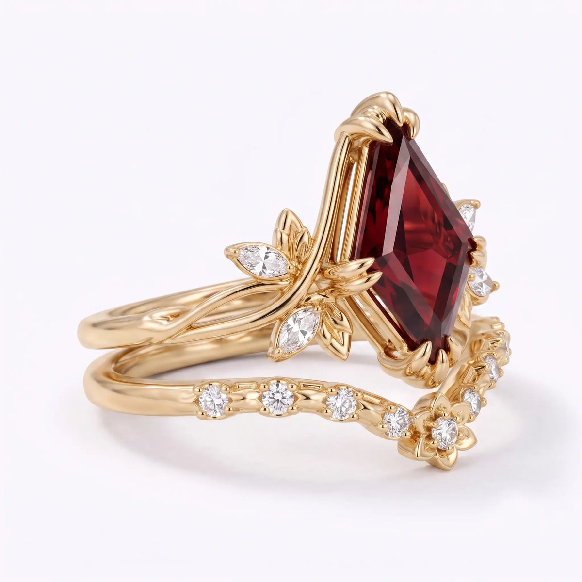 Side view of garnet bridal ring set showing curved floral band details