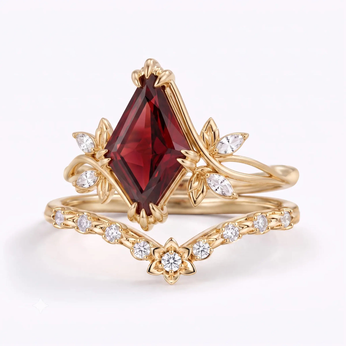 Natural garnet kite cut engagement ring with botanical inspired gold design