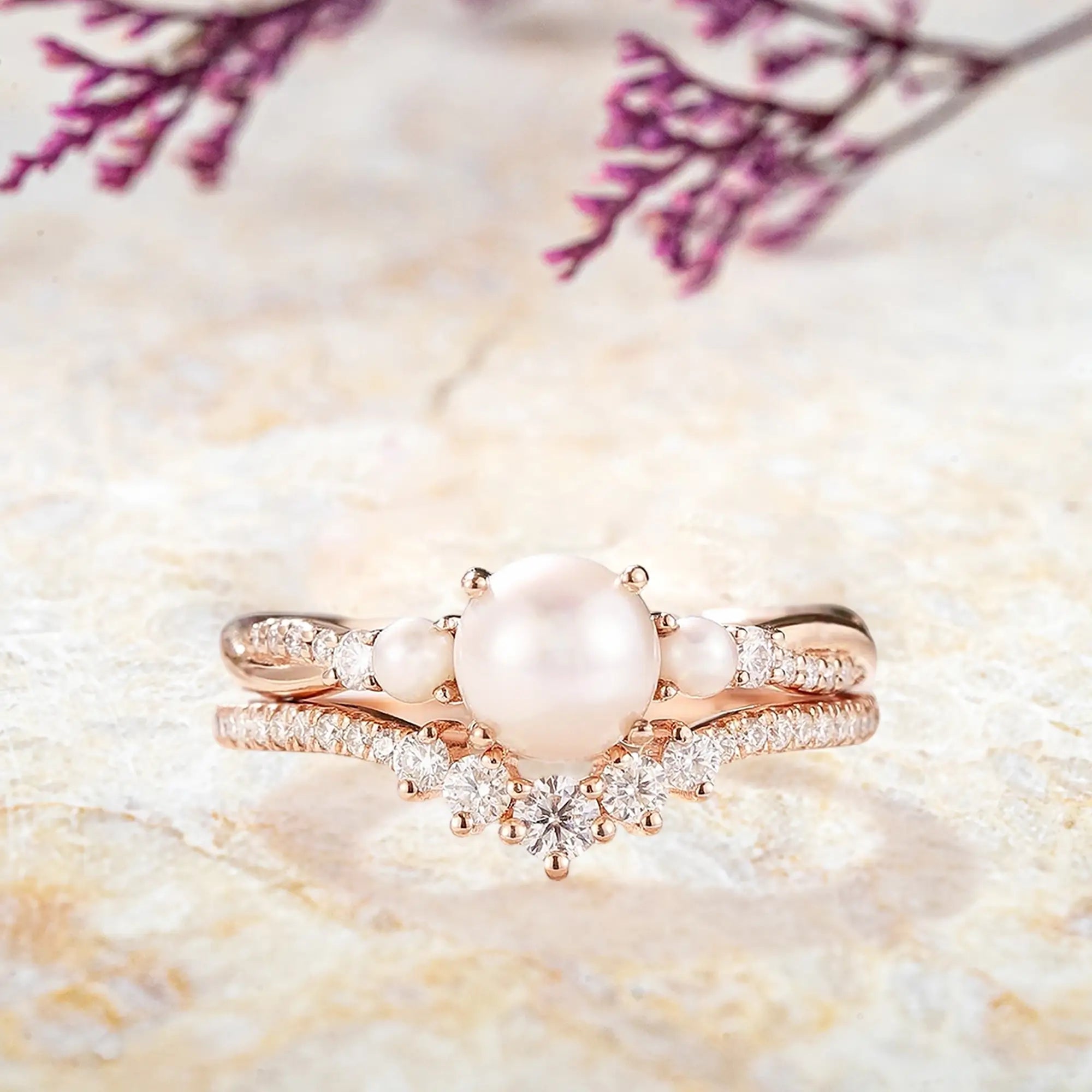 Round Akoya pearl engagement ring with rose gold three stone design
