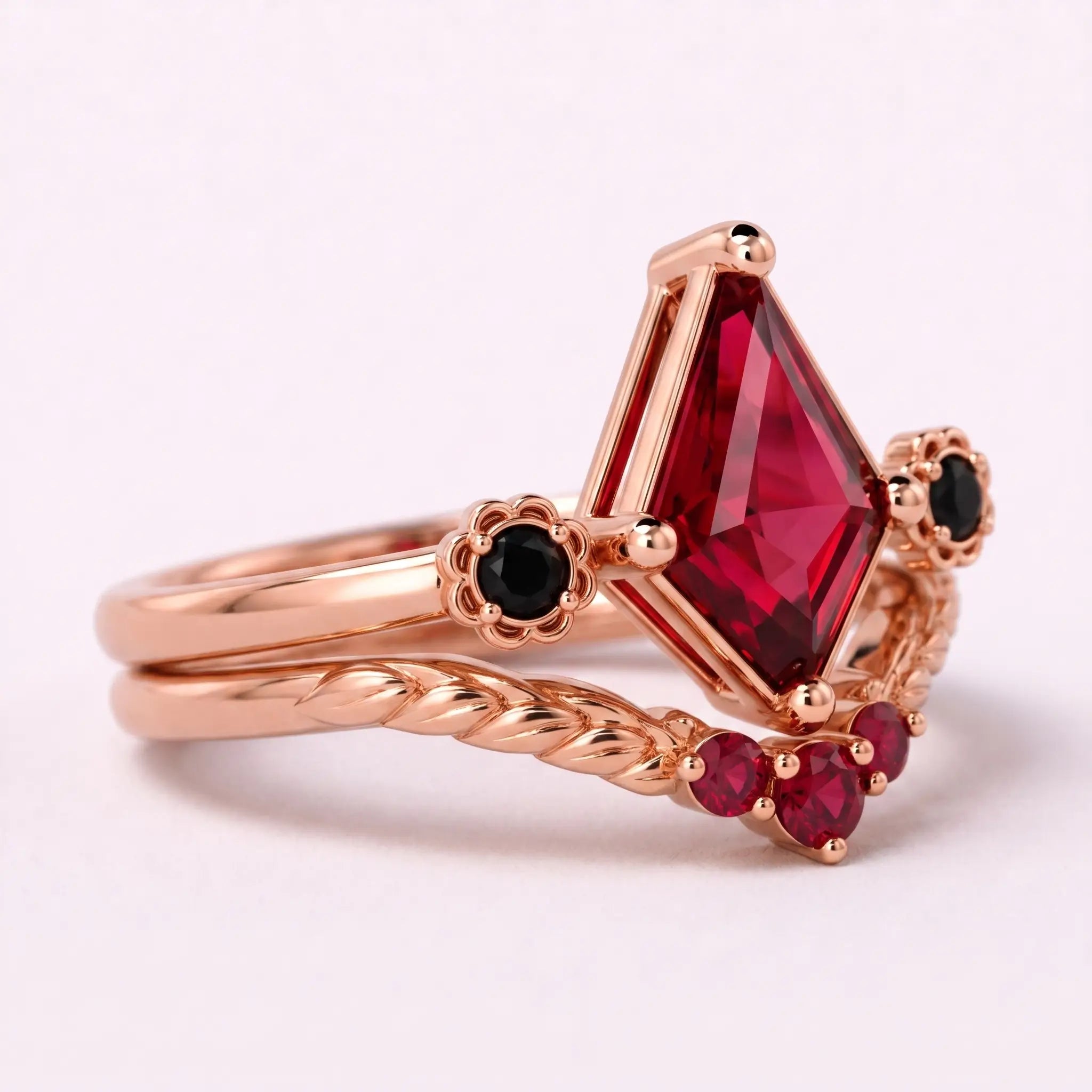 Side view of ruby bridal ring set showing the layered gold band design
