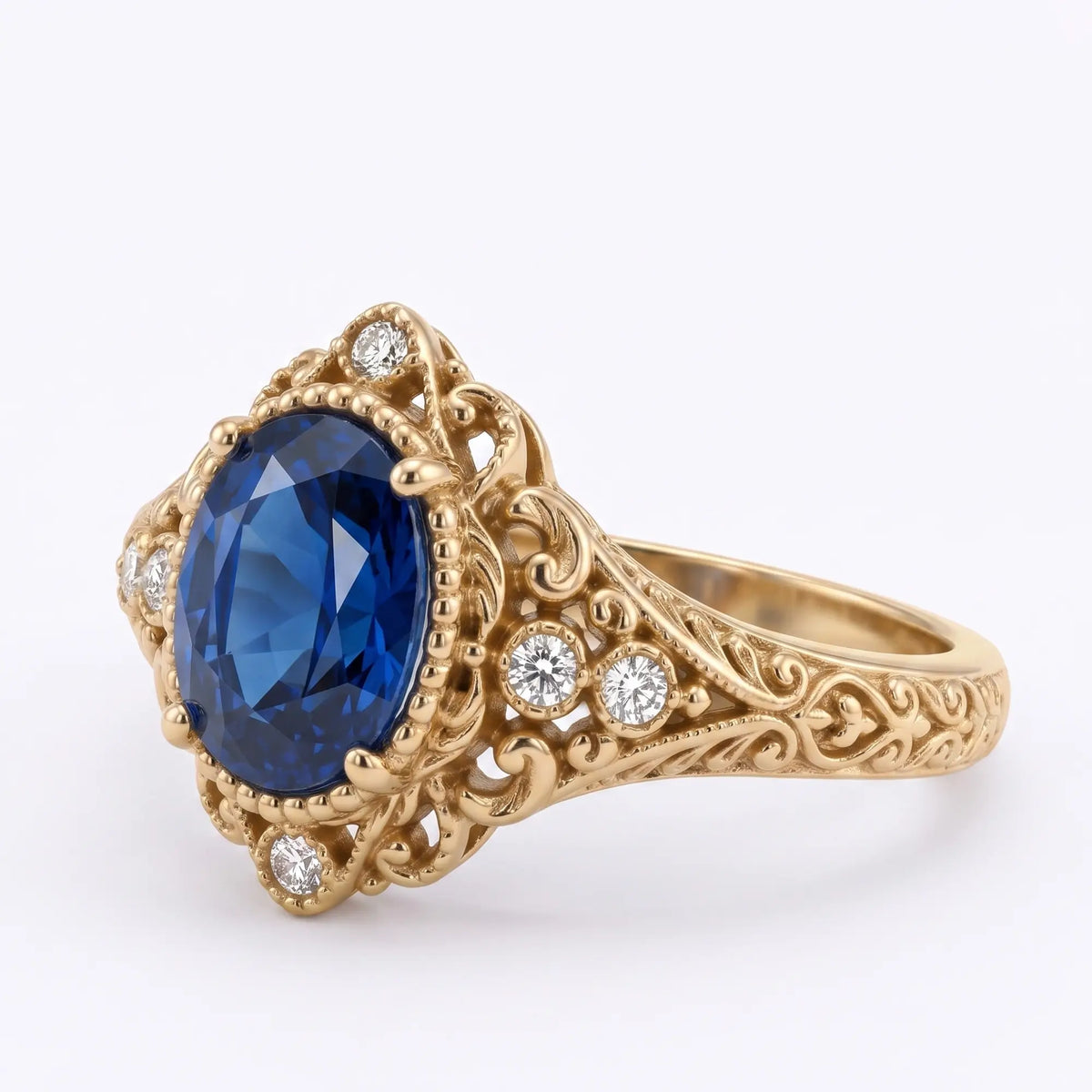 Front view of oval lab sapphire ring with romantic Victorian detailing