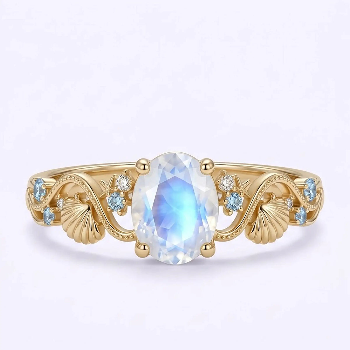 Oval natural moonstone ocean inspired engagement ring in yellow gold