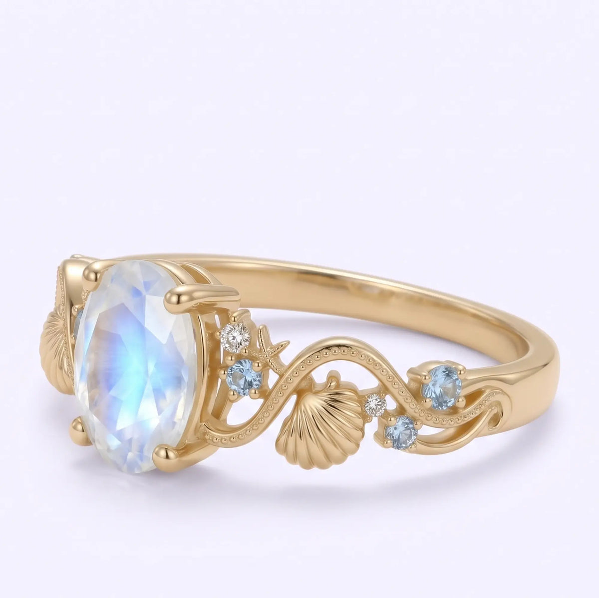 Vintage moonstone engagement ring with aquamarine and moissanite accents