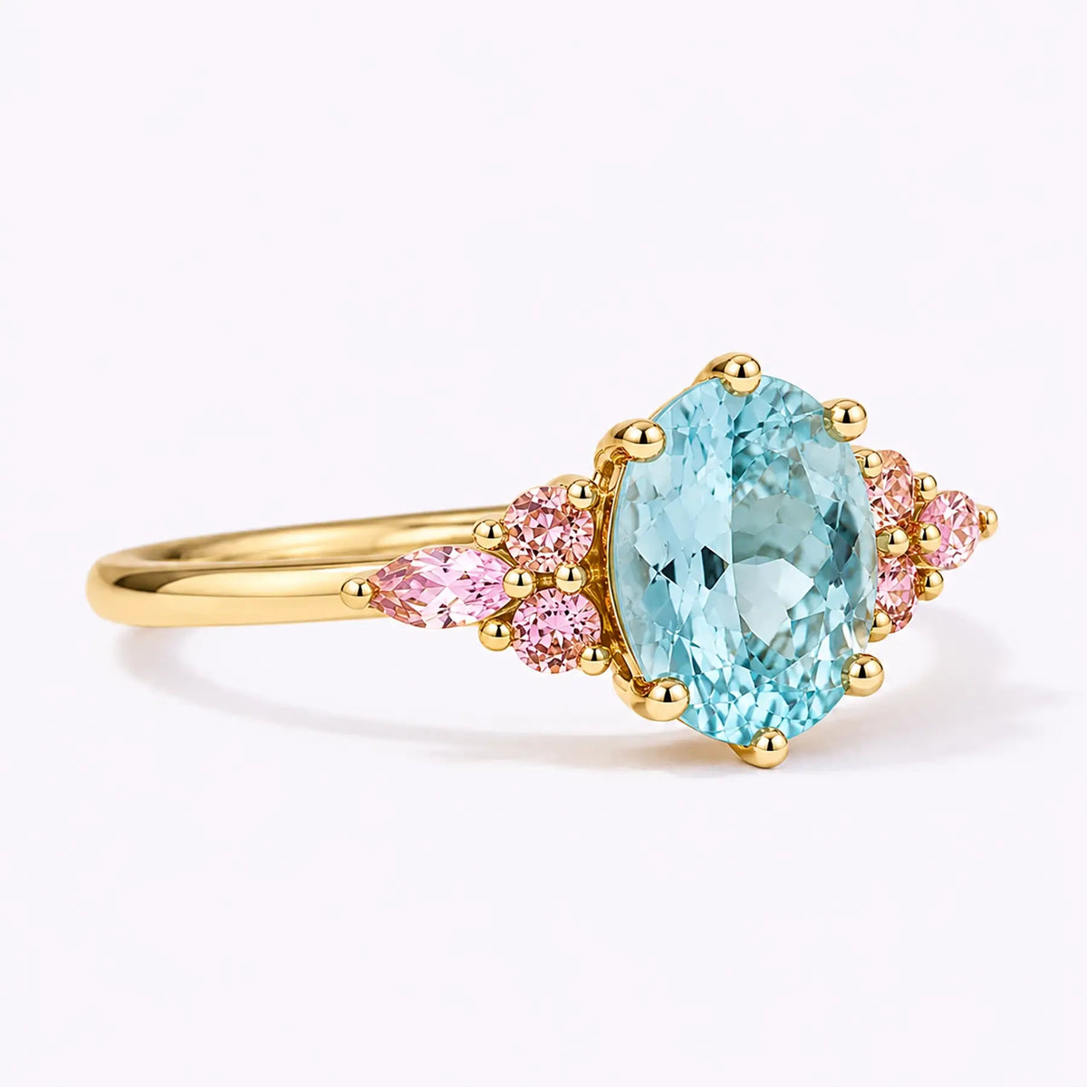 Side view of classic aquamarine cluster ring showing slim gold band structure