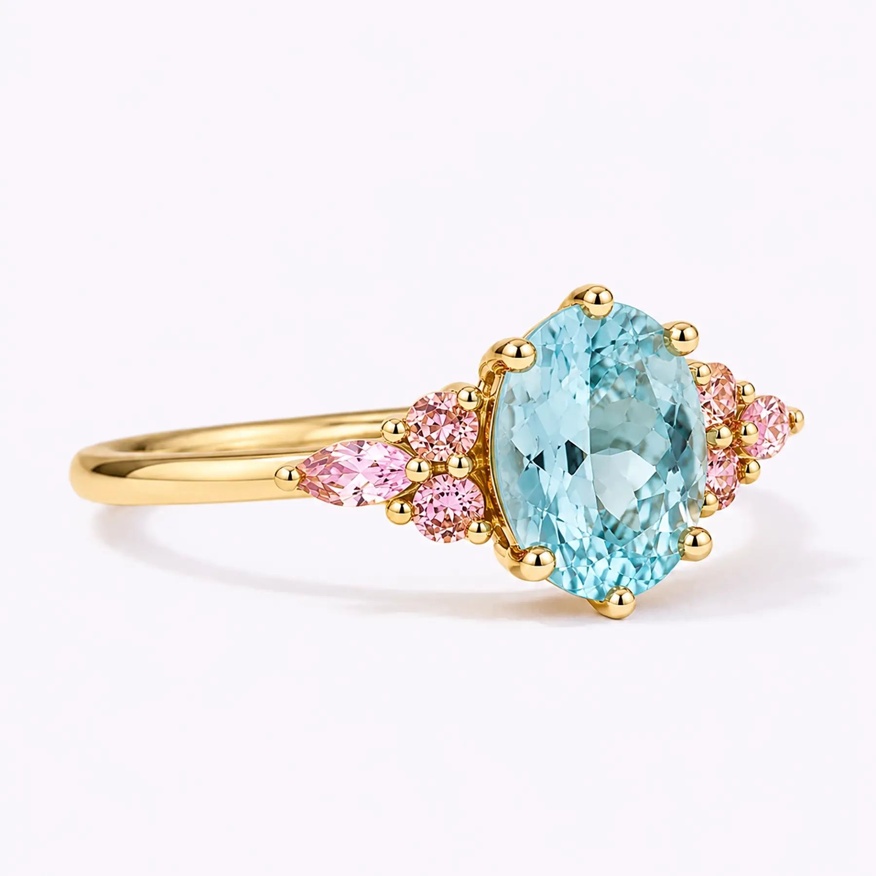 Side view of classic aquamarine cluster ring showing slim gold band structure