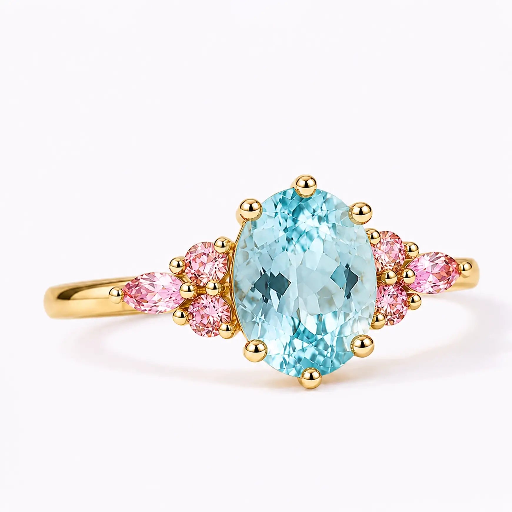 Close-up of oval aquamarine center stone with soft pink quartz accents