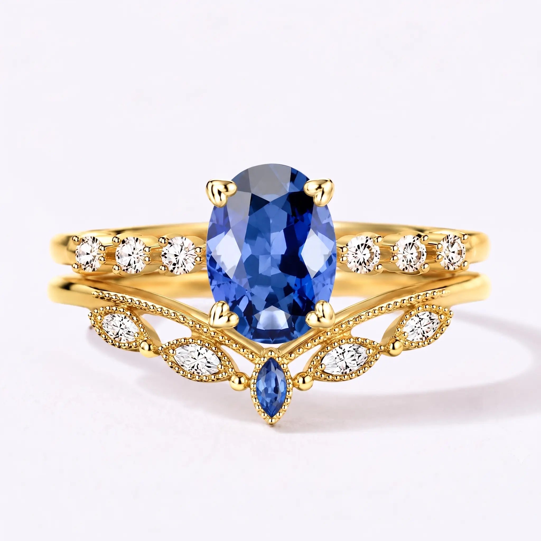 Vintage oval sapphire bridal ring set with chevron wedding band in yellow gold