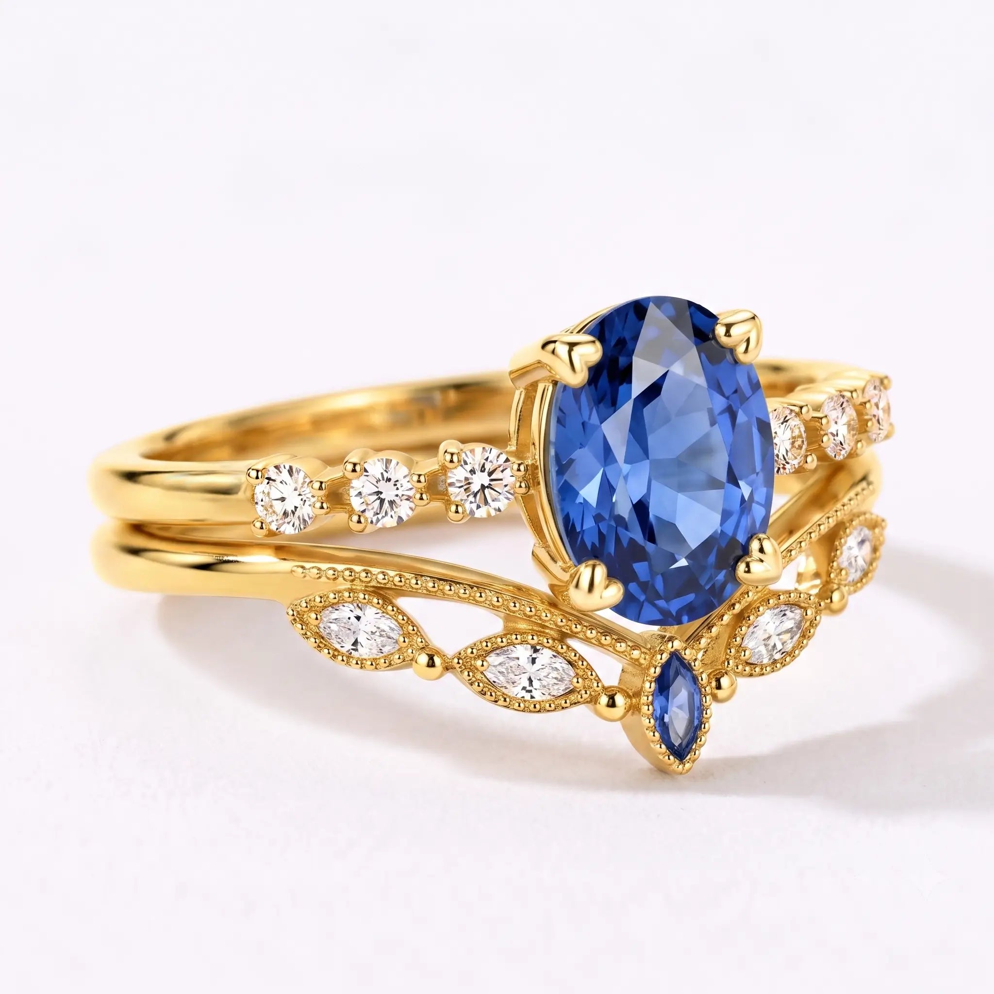 Side view of sapphire bridal ring set showing layered vintage band design