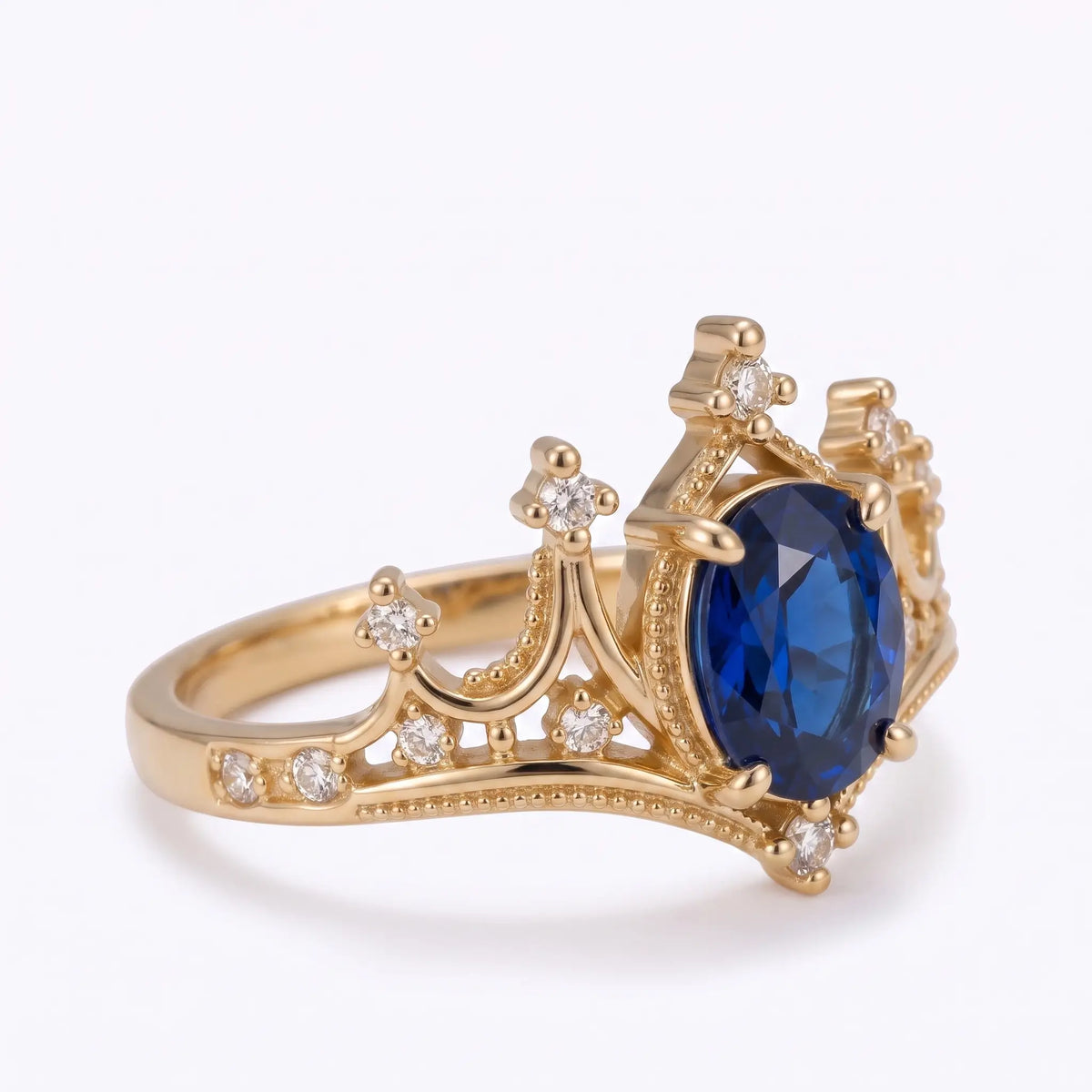 Regal vintage sapphire ring with crown silhouette and milgrain detail