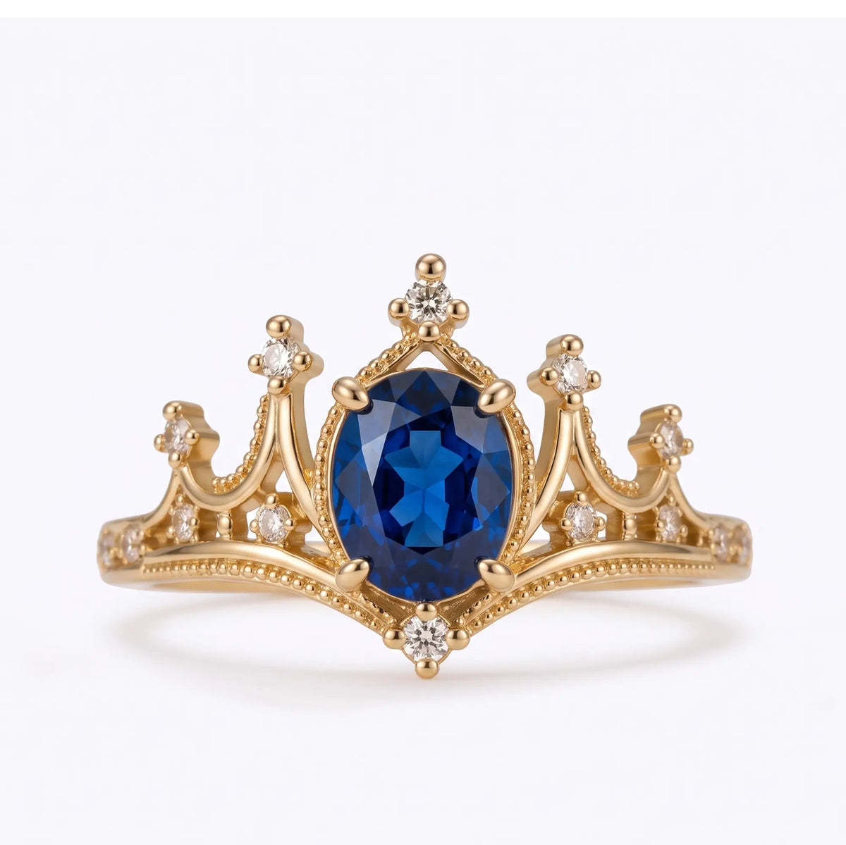 Vintage oval sapphire crown engagement ring in yellow gold