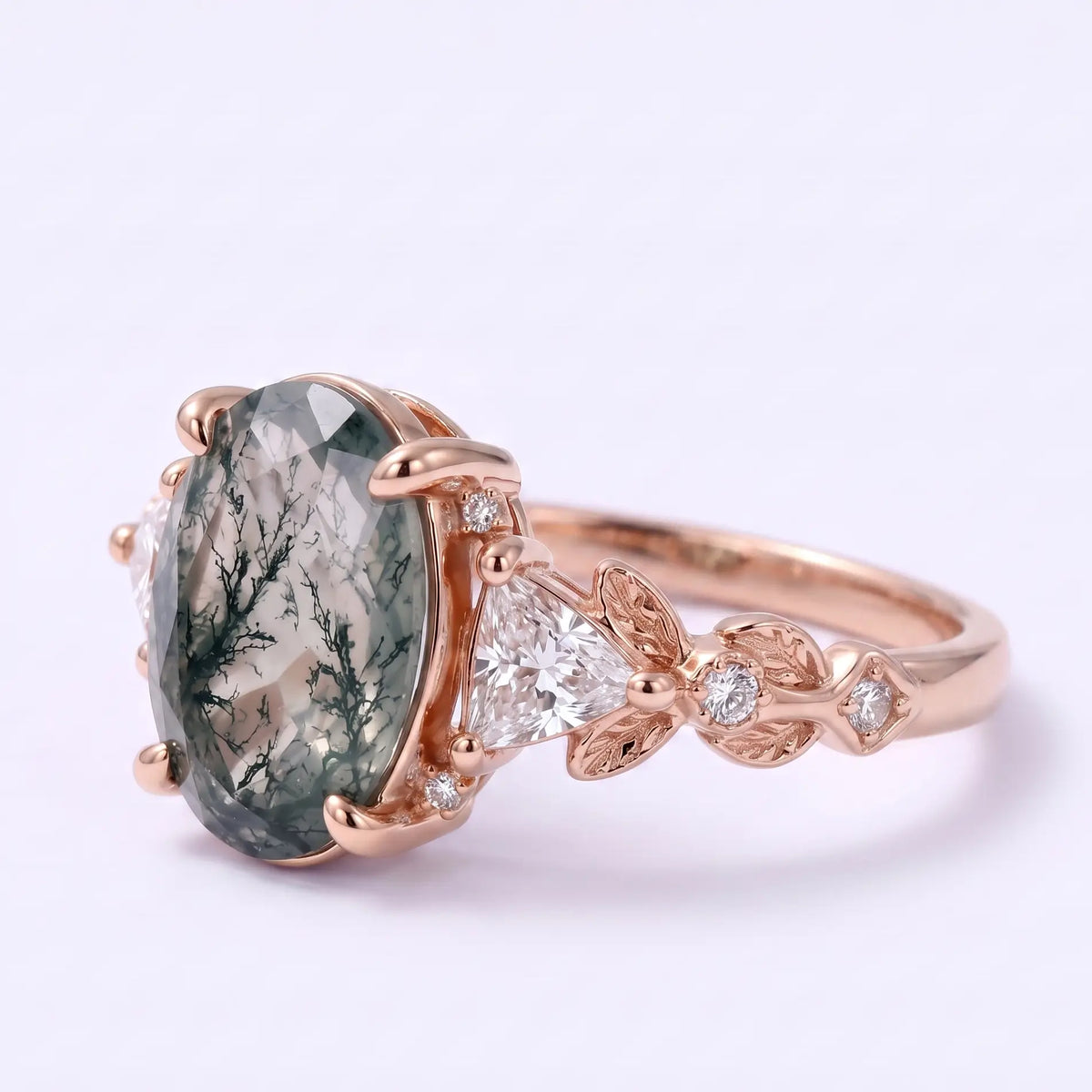 Front view of botanical oval moss agate engagement ring in gold