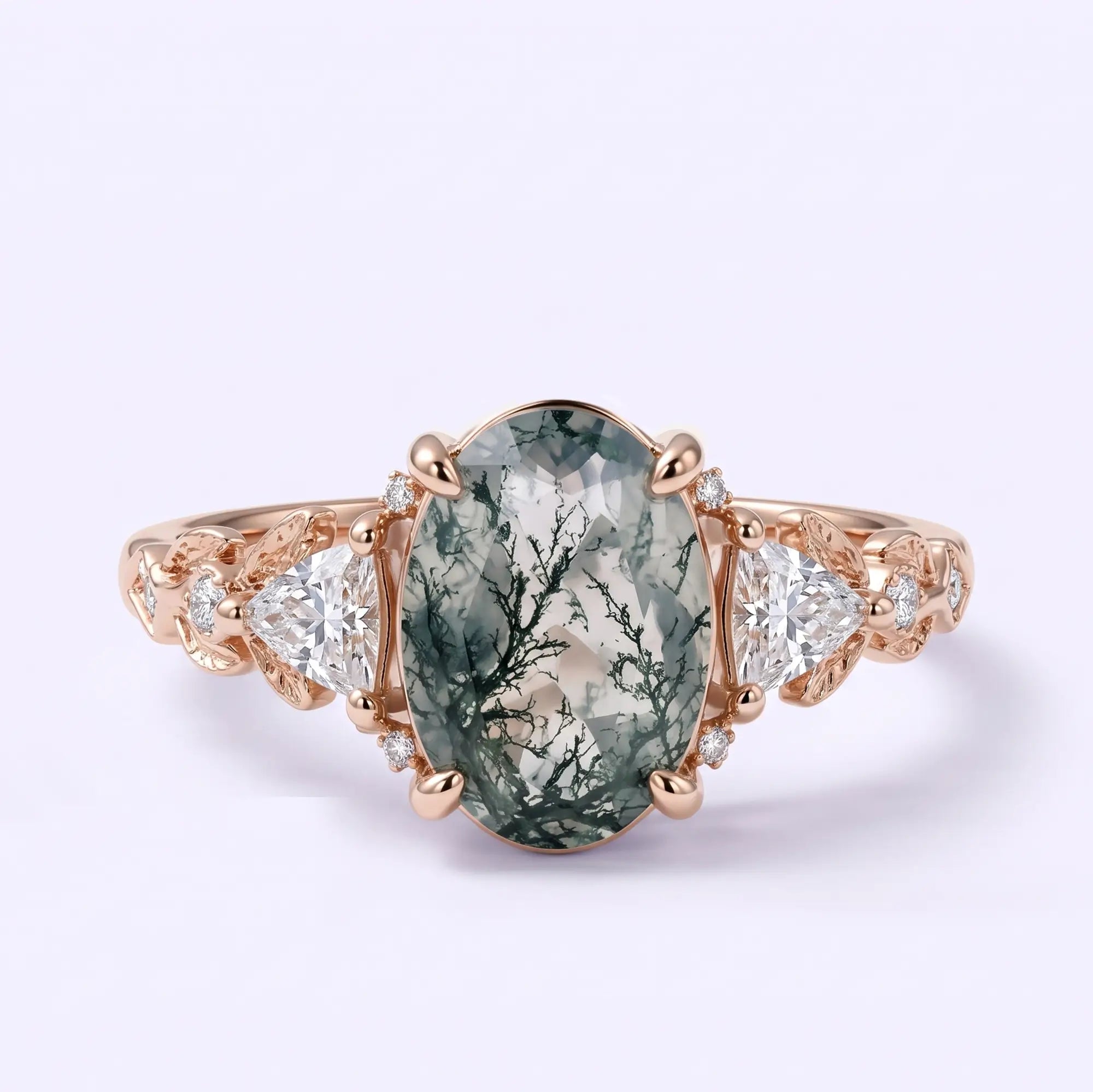 Oval moss agate leaf engagement ring with trillion and round moissanite accents