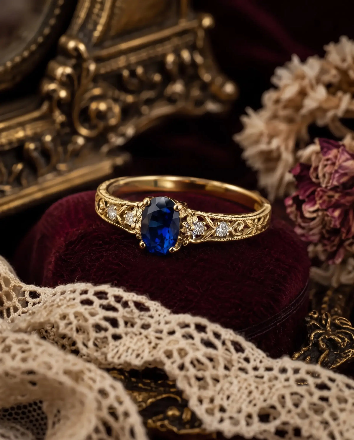 Side view of vintage sapphire engagement ring with botanical openwork