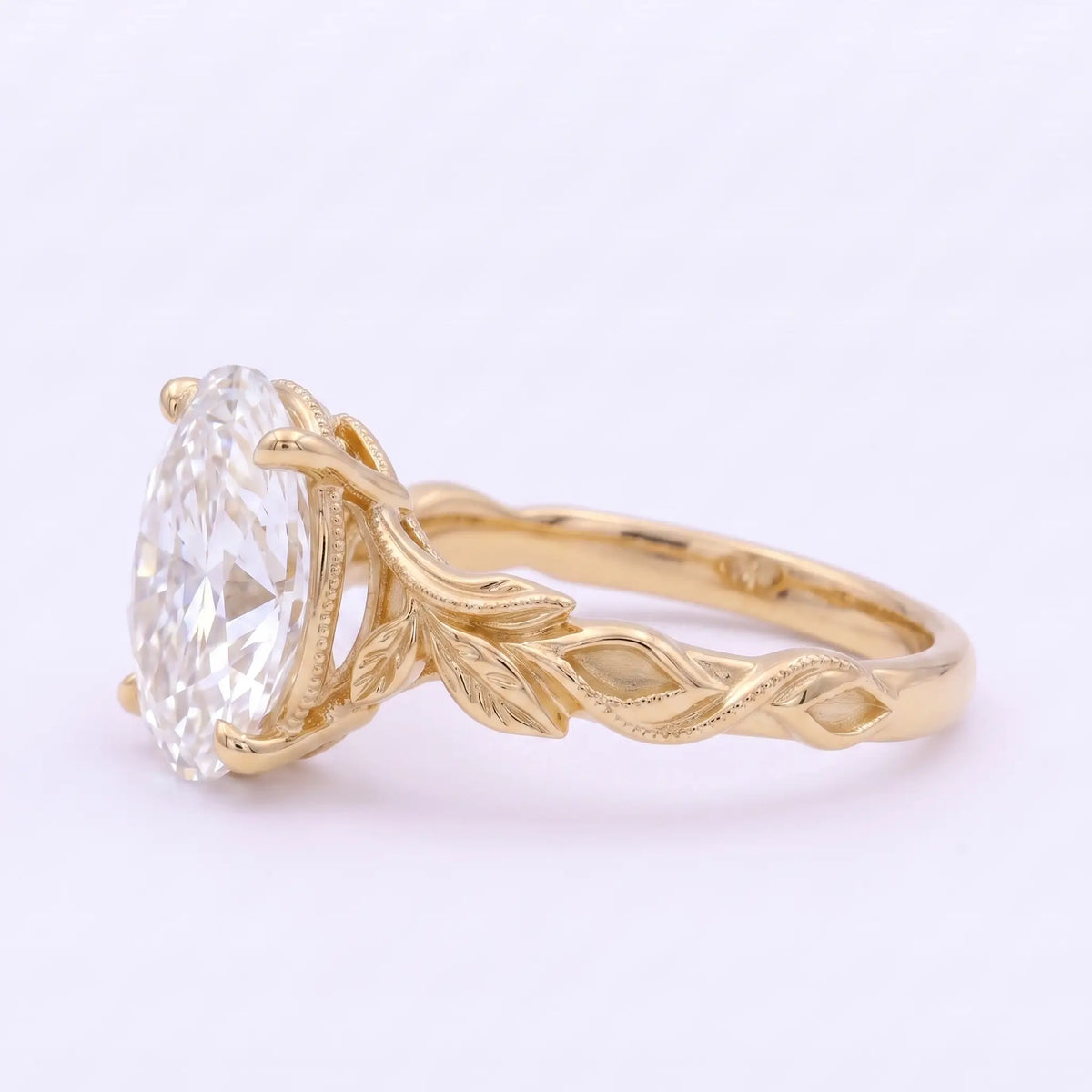 Nature inspired oval moissanite ring with sculpted leaf details