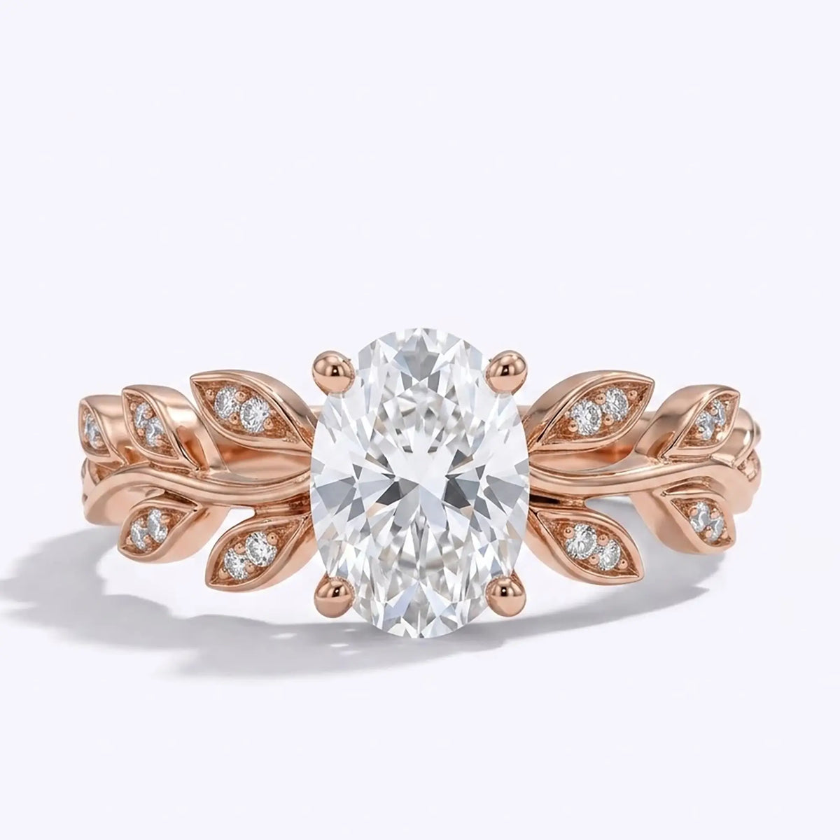 Oval moissanite leaf engagement ring in rose gold